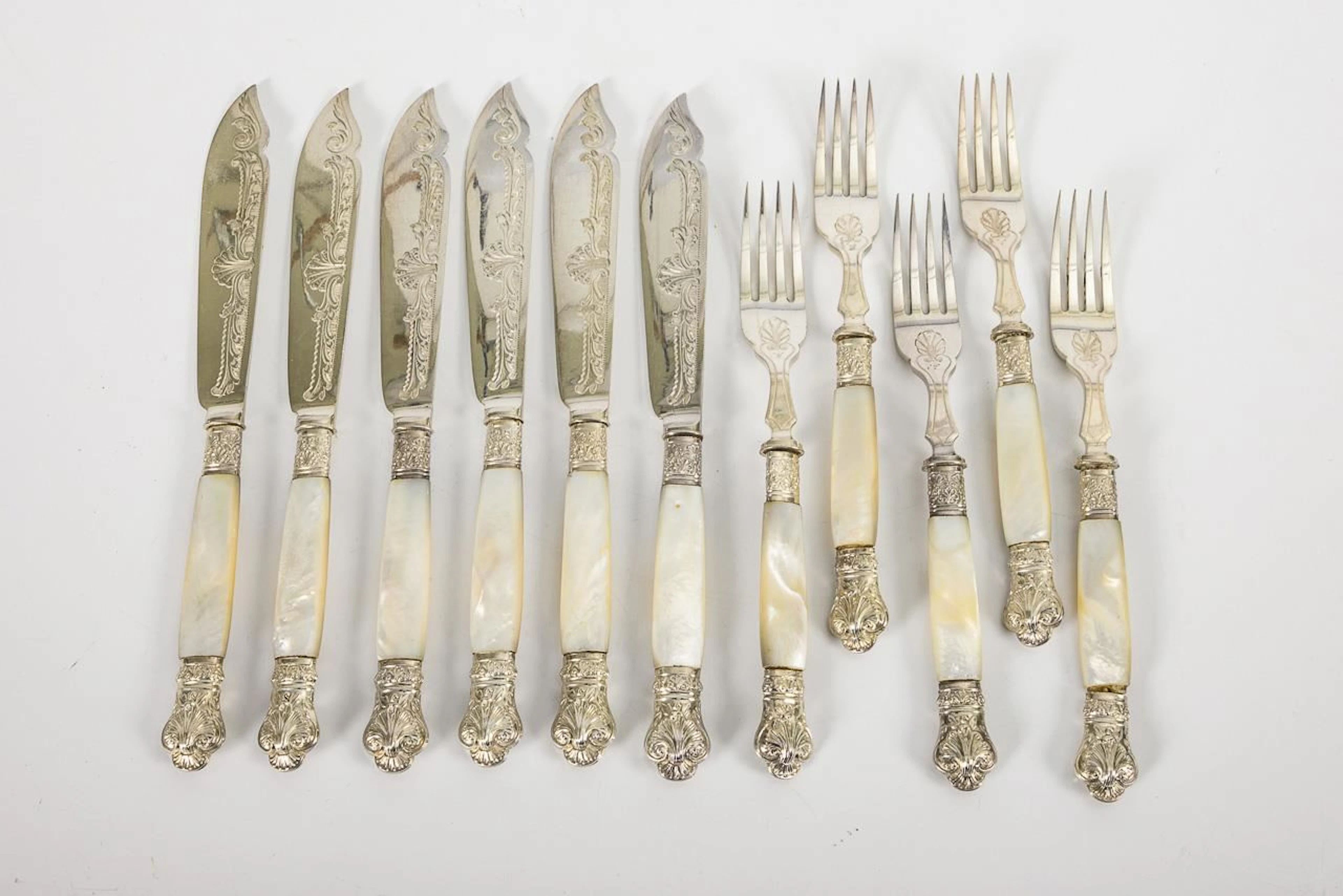 English fish cutlery with mother-of-pearl handles. Plated.