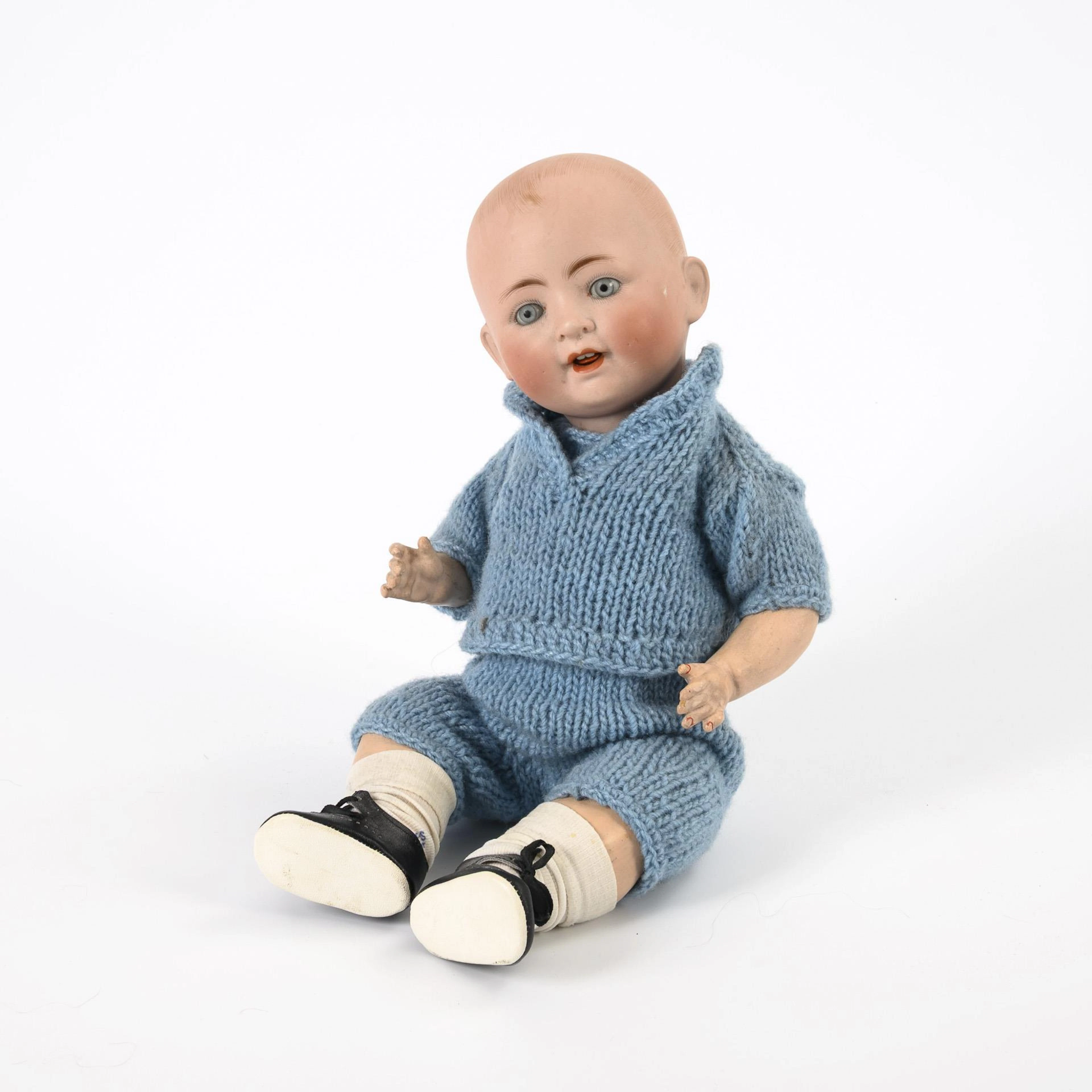Character boy with full head. Louis Wolf & Co.