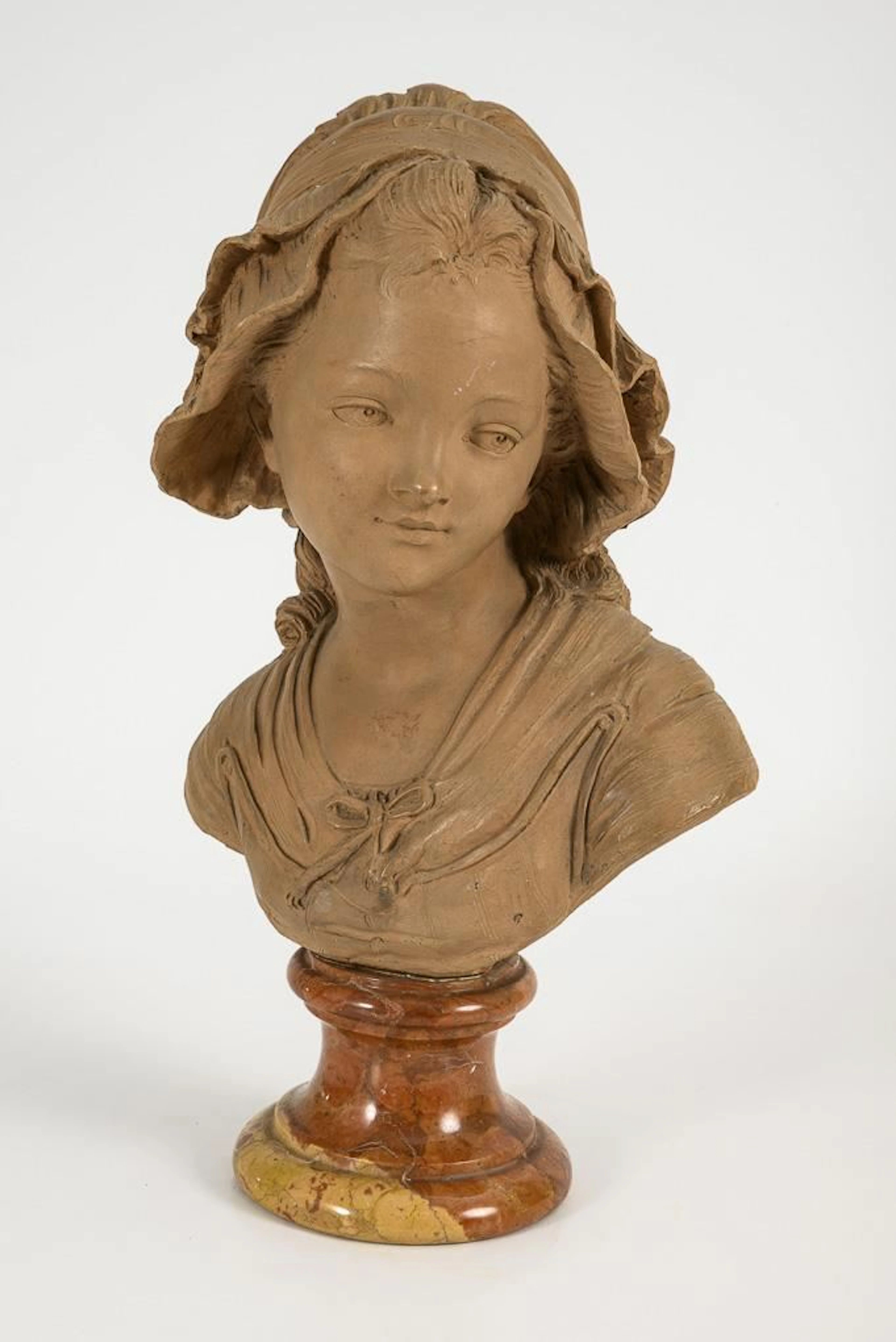 NIAM, NIAM, NIAM, Bust of a girl wearing a hat