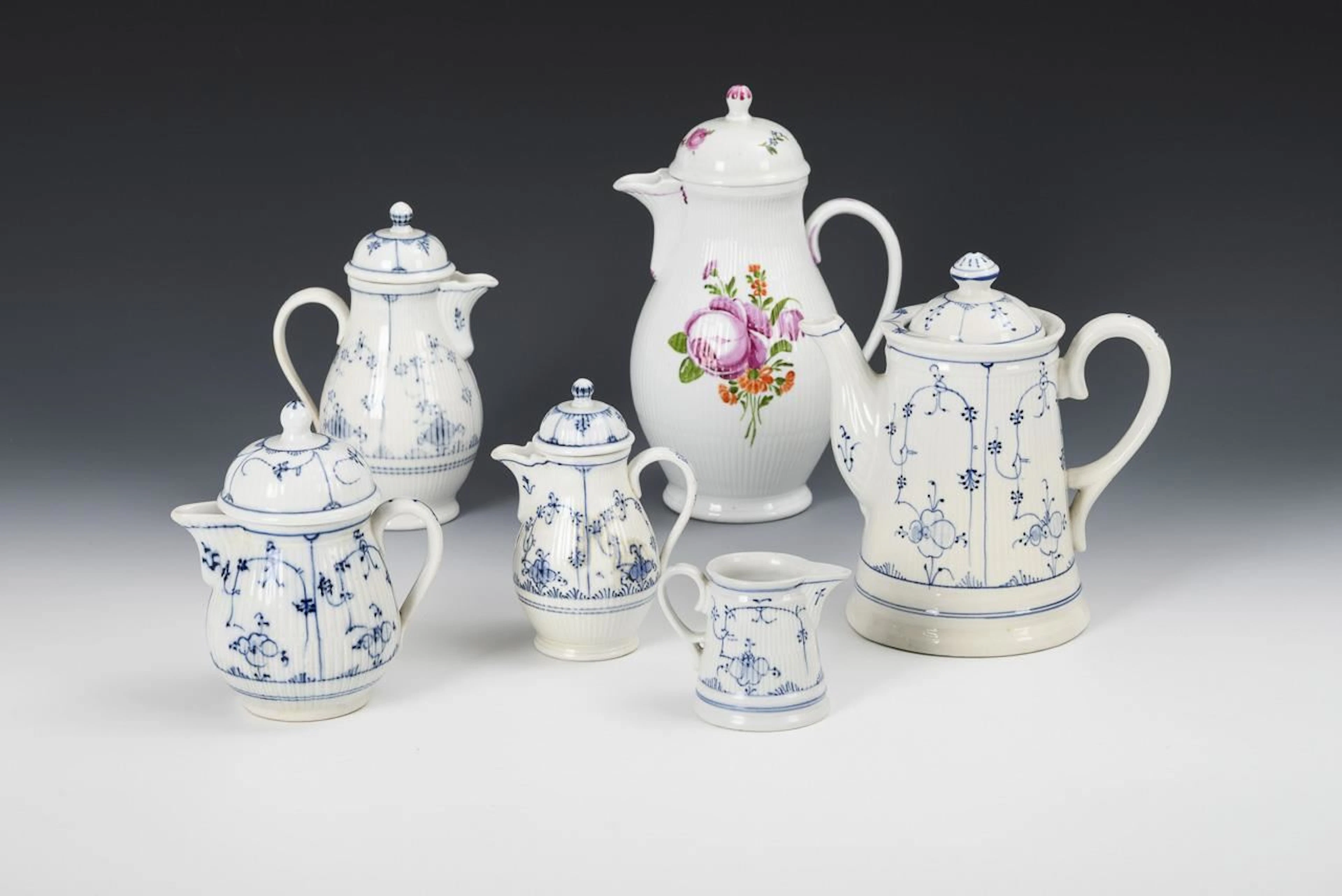 5 teapots and 1 milk jug. Rauenstein.