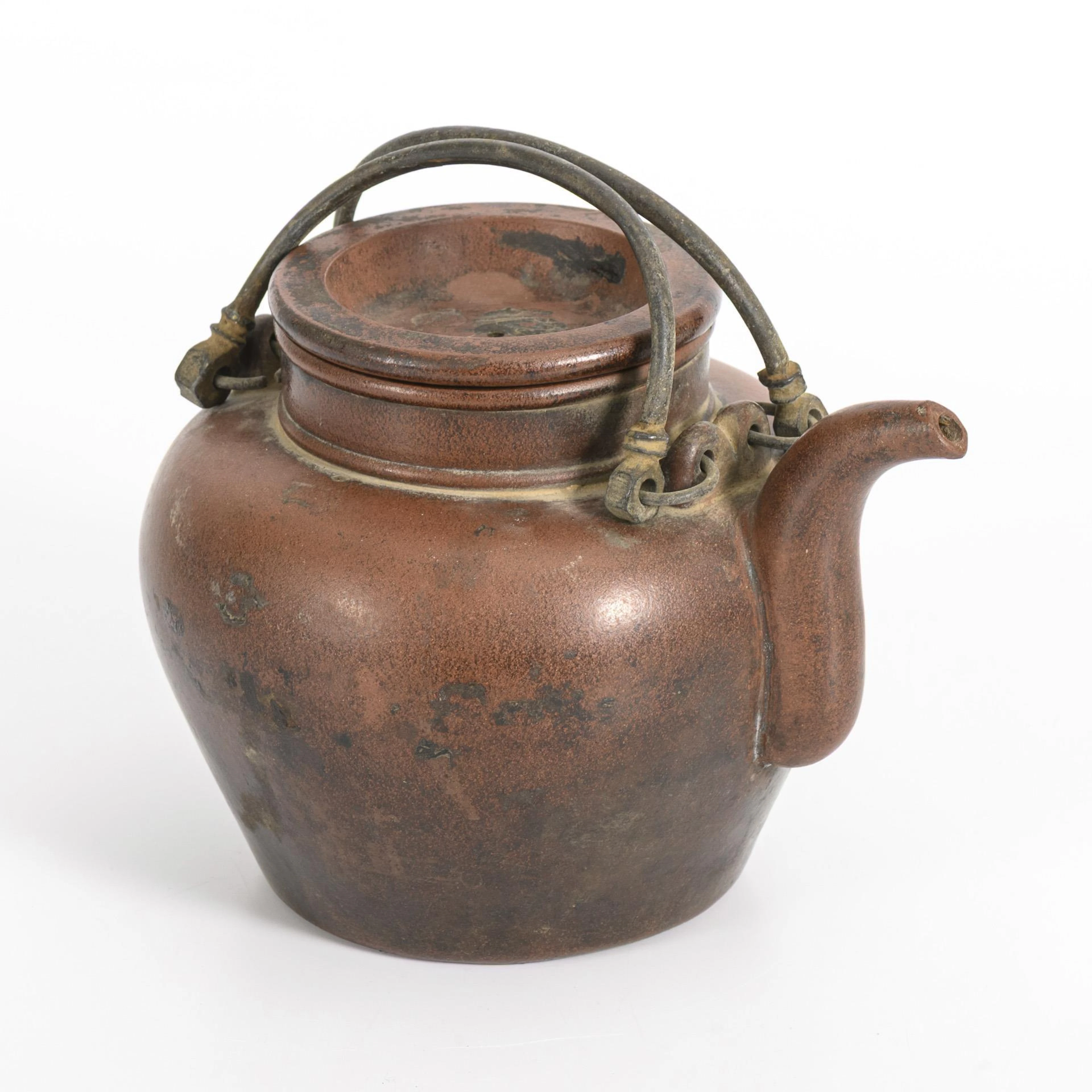 Teapot made of brown stoneware.
