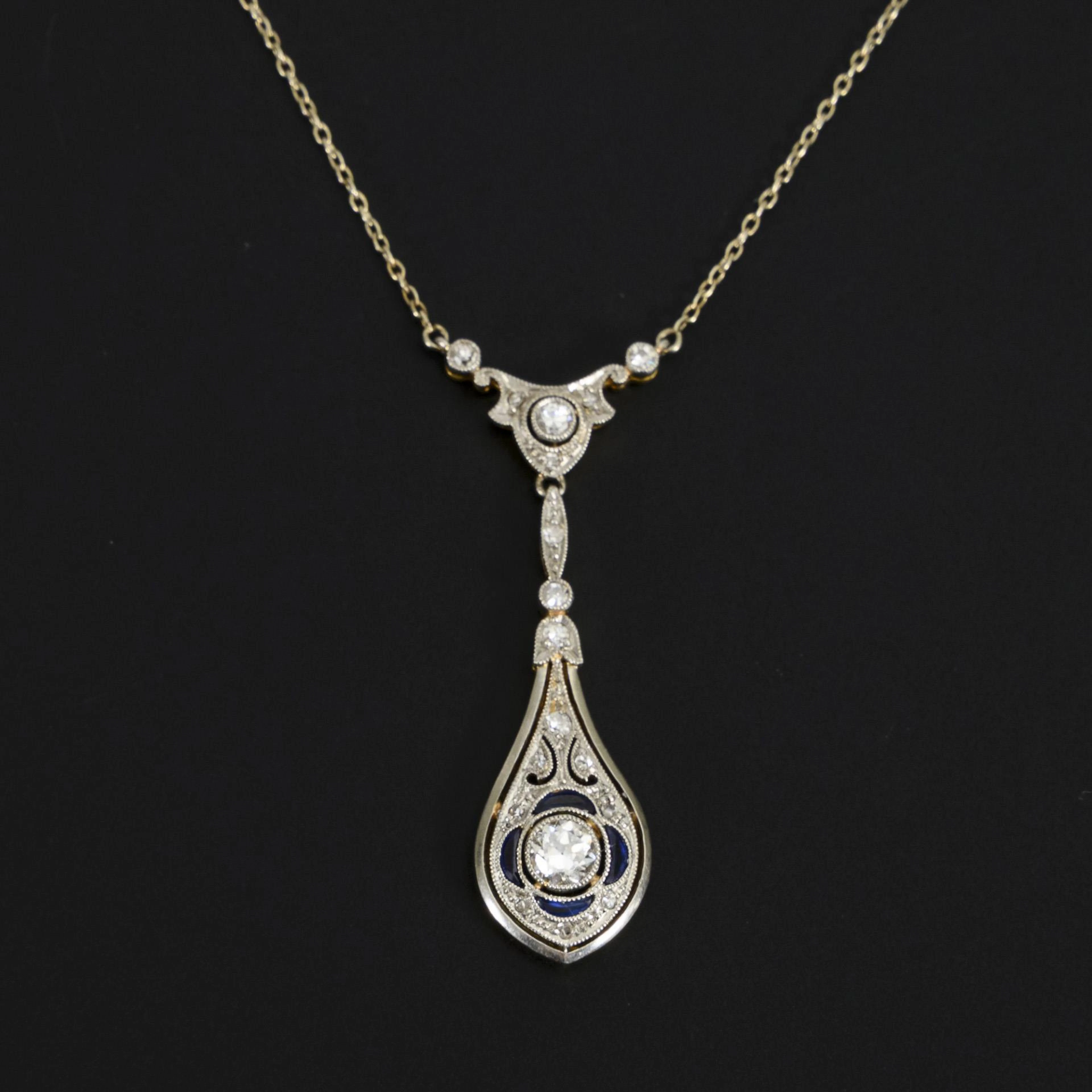 Art deco necklace with old-cut diamonds and blue colored stones.