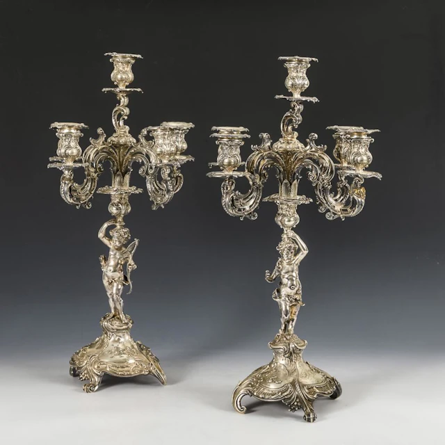 A pair of ornate silver candlesticks. Bruckmann & Söhne, Heilbronn.