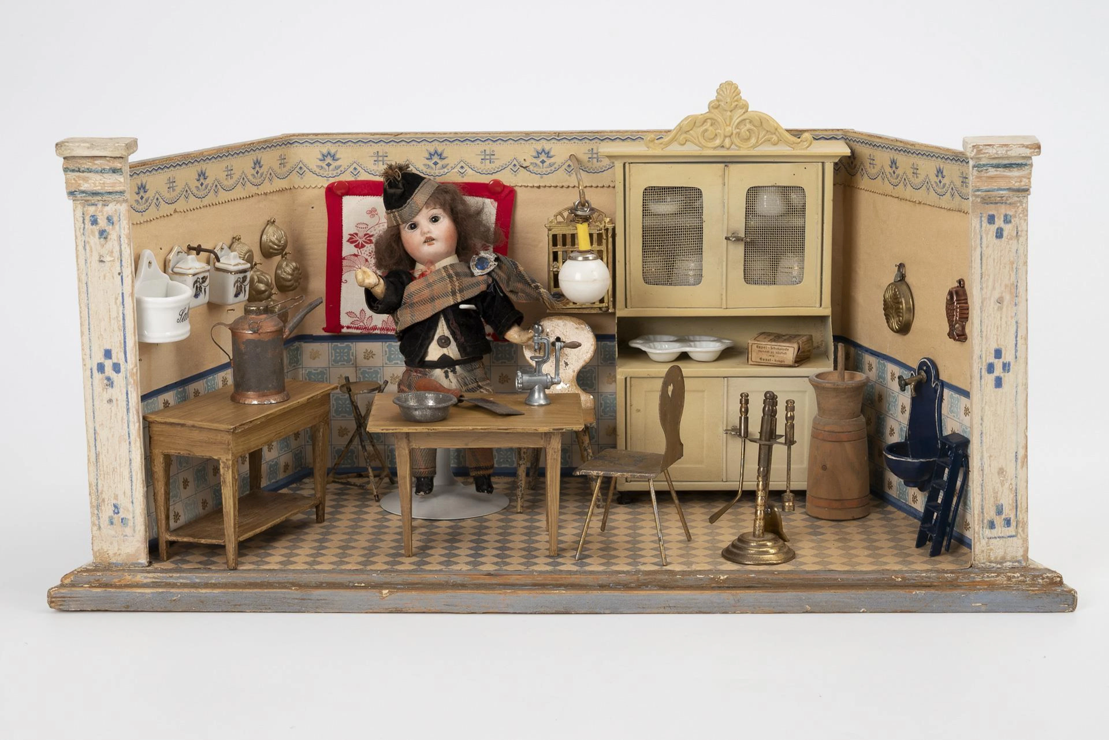 Small doll's kitchen with tin furniture.