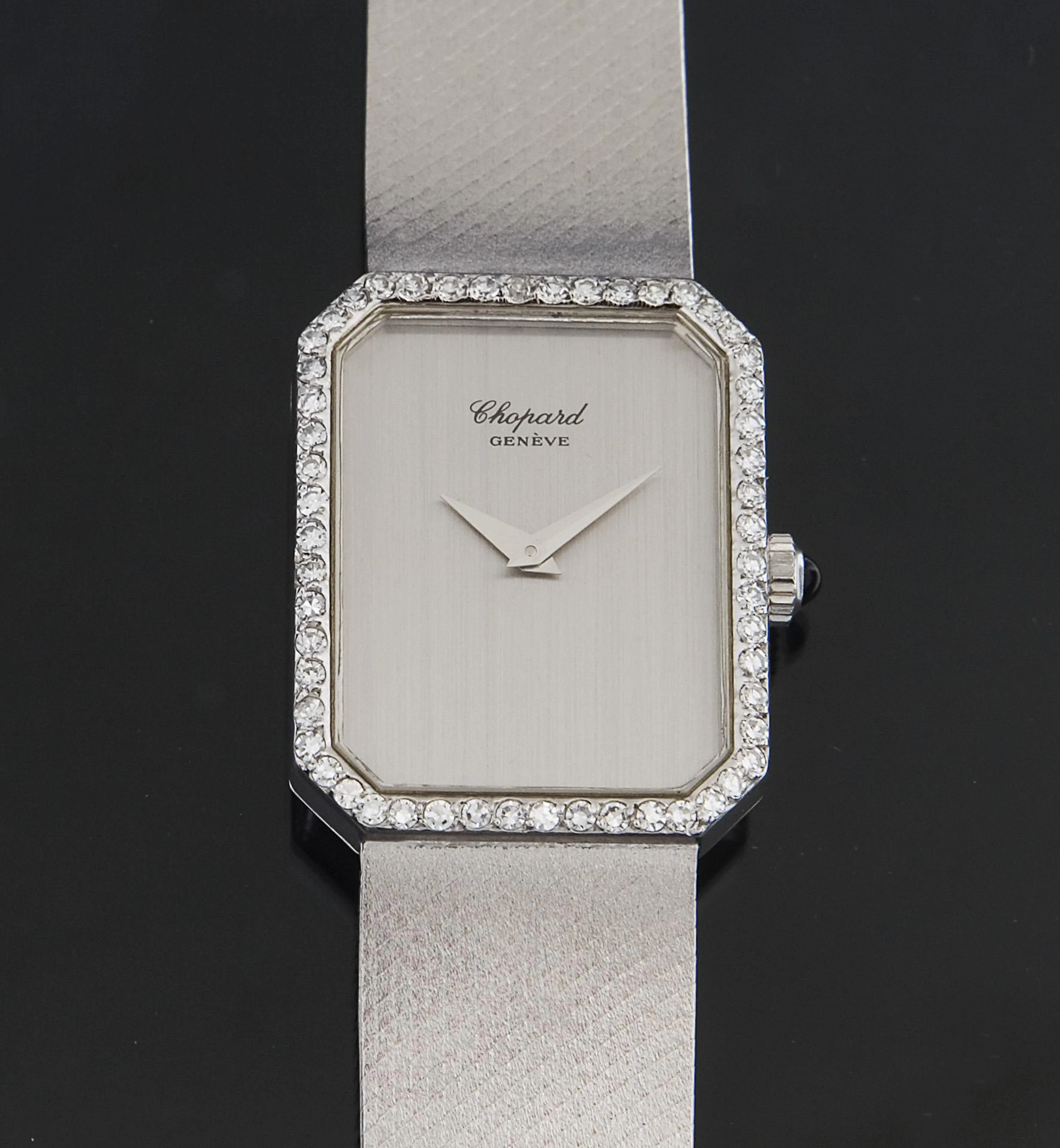 Gold wristwatch with diamond bezel. Chopard.