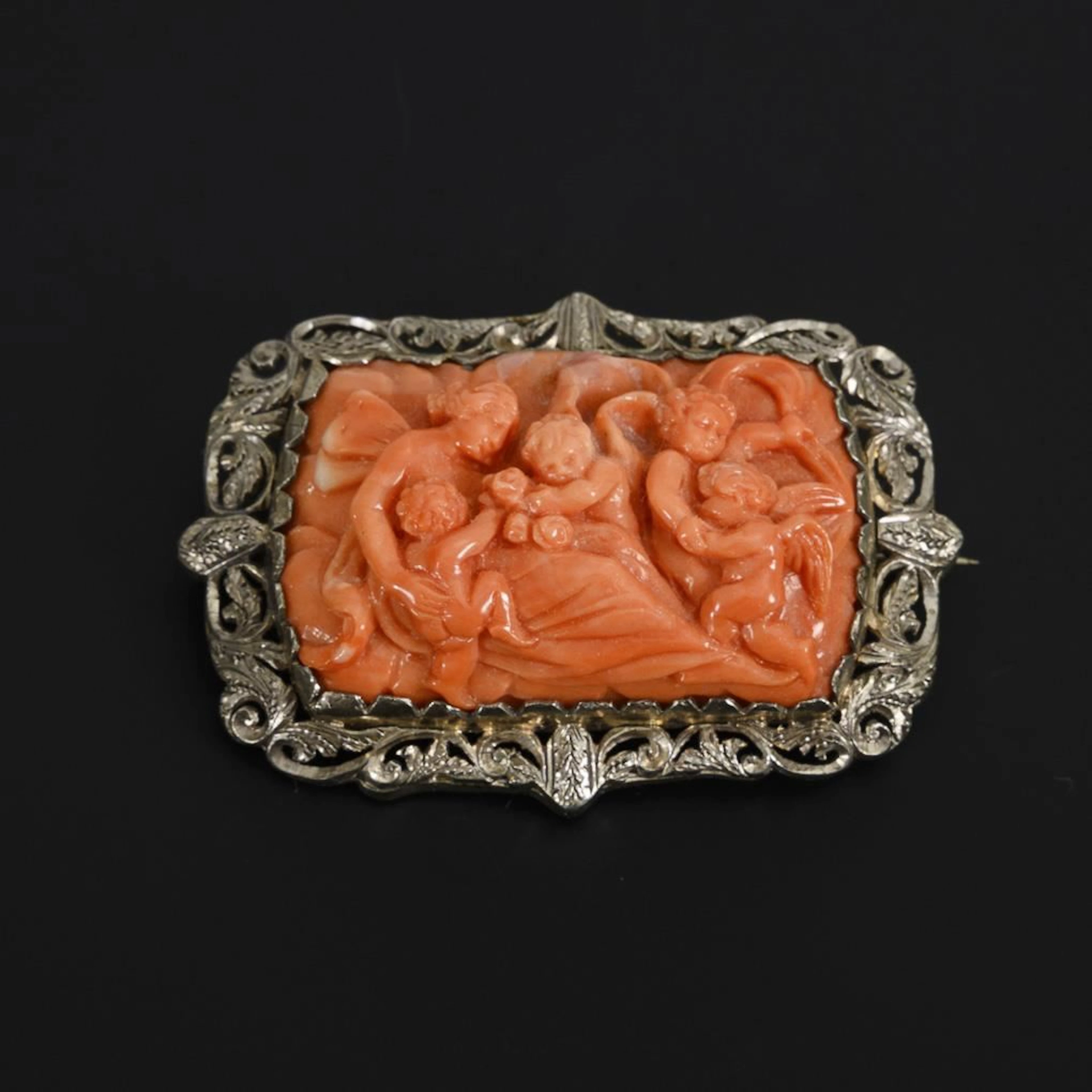 Brooch with a large coral cameo.