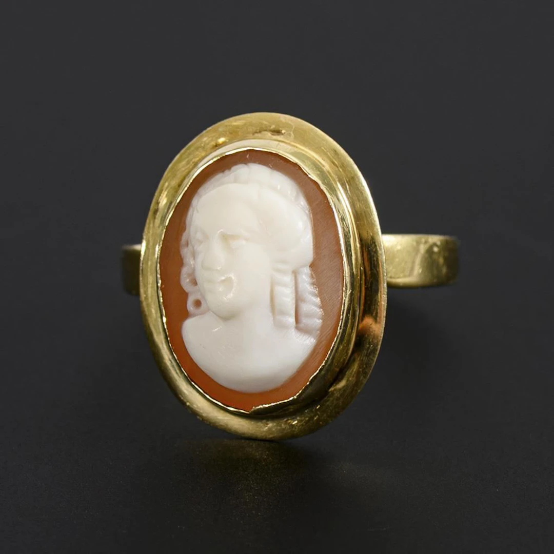 Ring with a shell cameo.