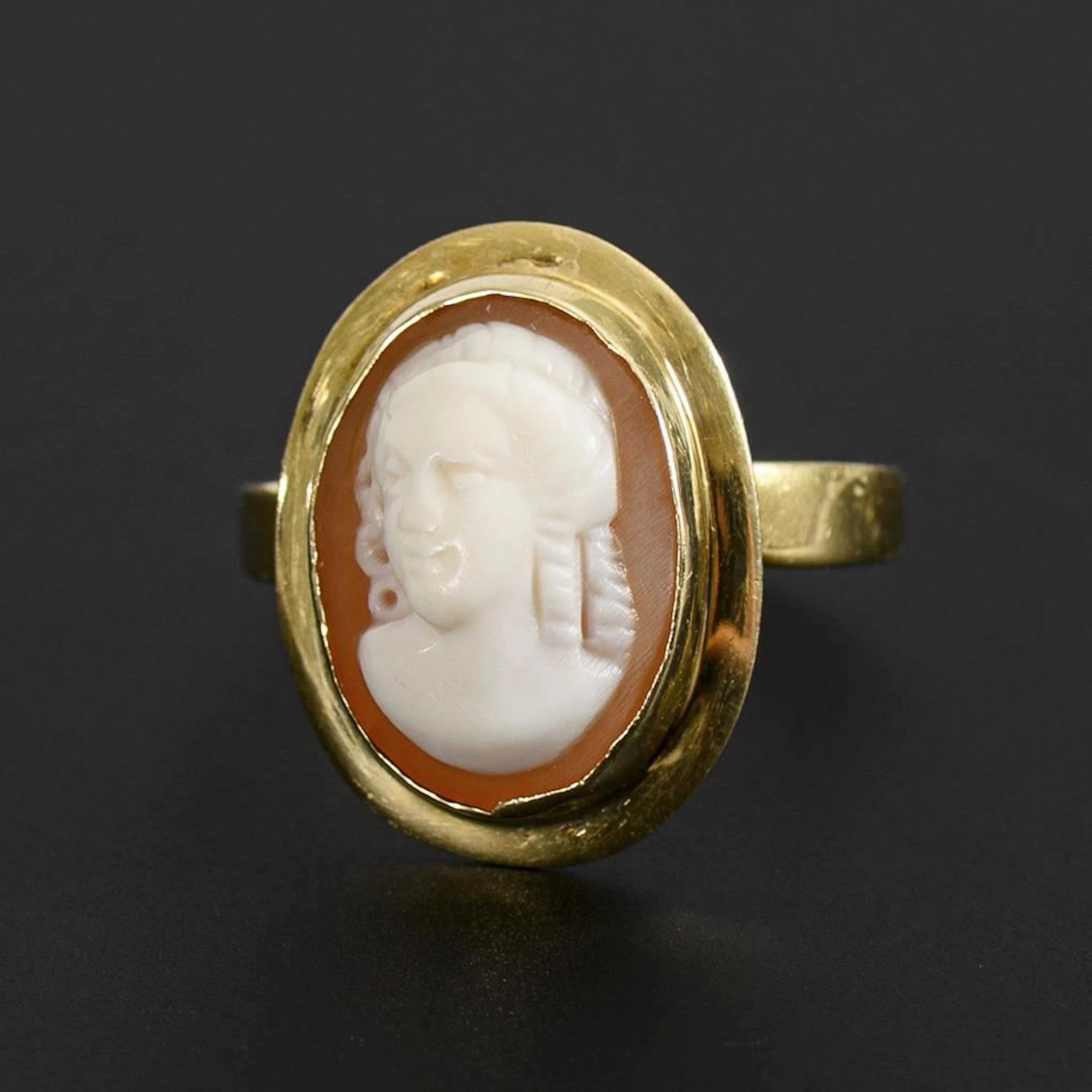 Ring with a shell cameo.
