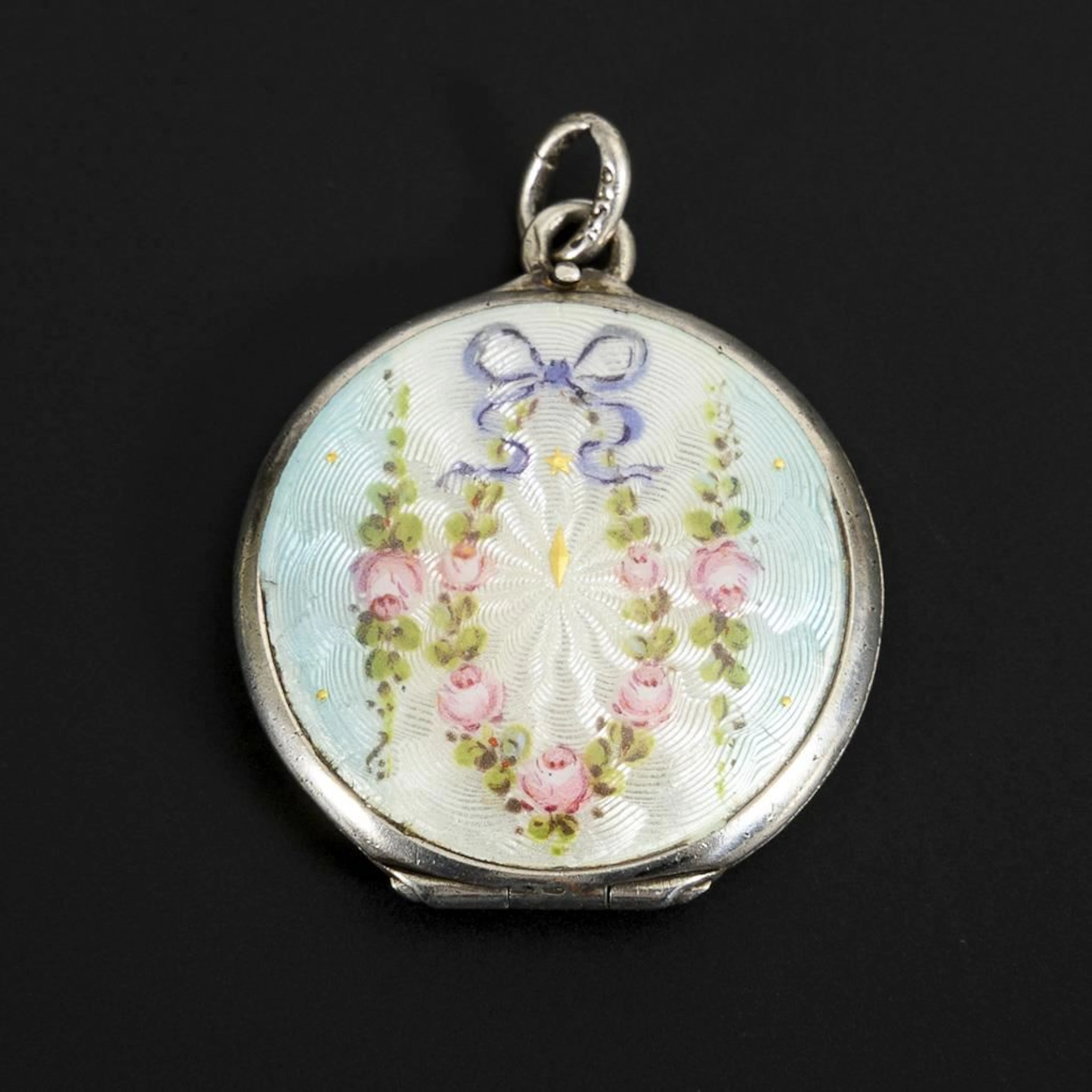 Medallion with guilloche enamel.