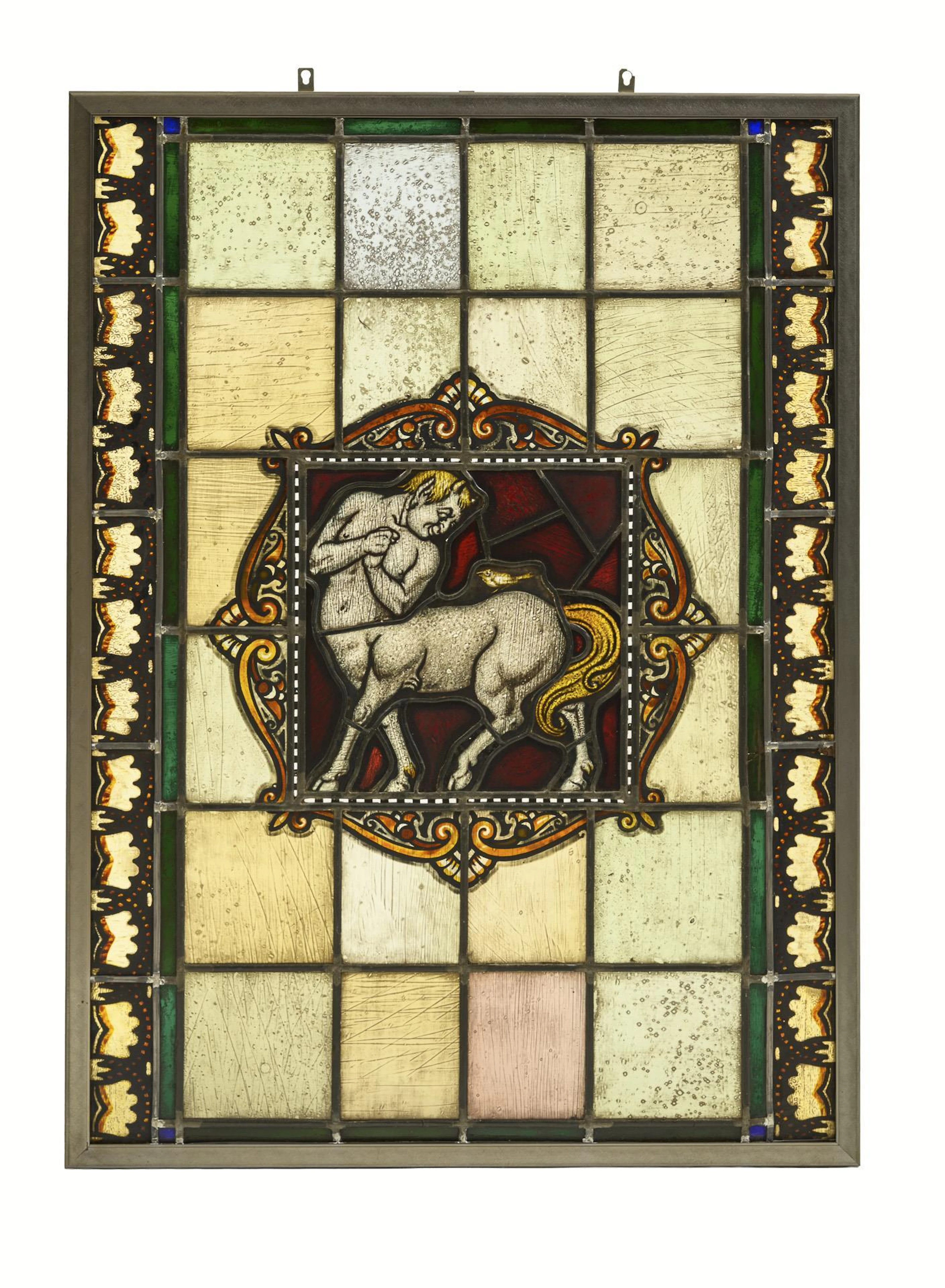Large stained glass window with centaur.