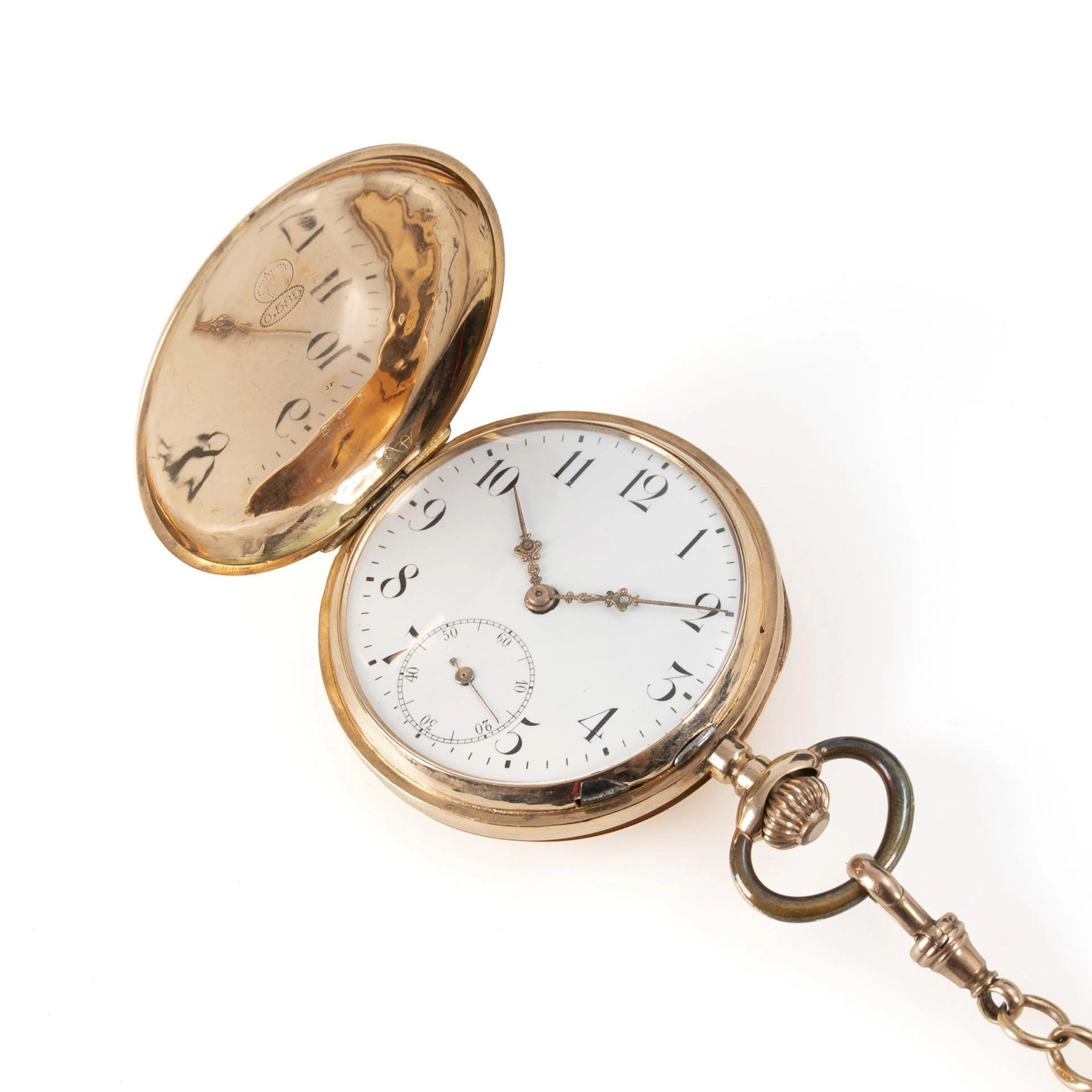 Golden savonnette with golden watch chain.