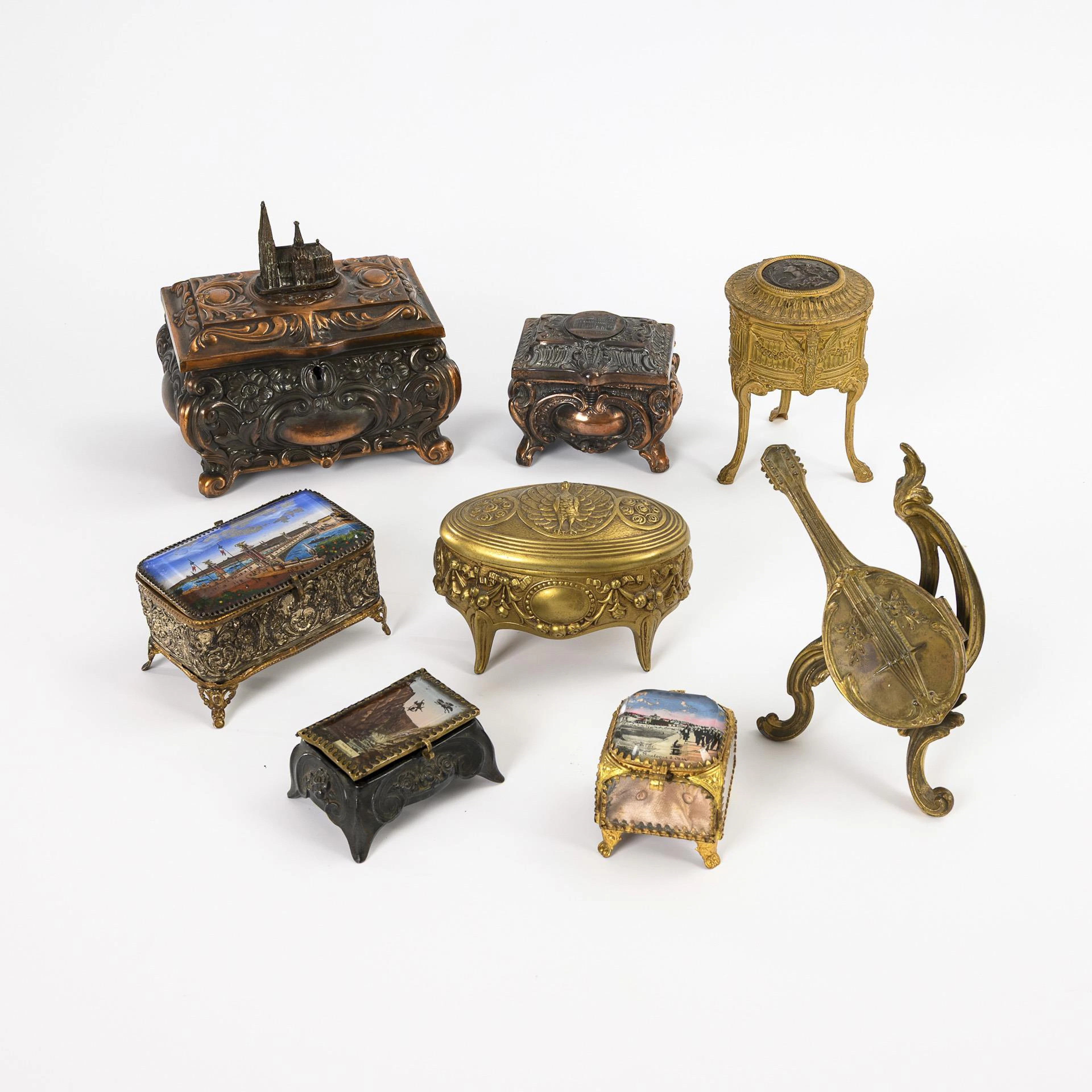 8 decorated metal boxes.