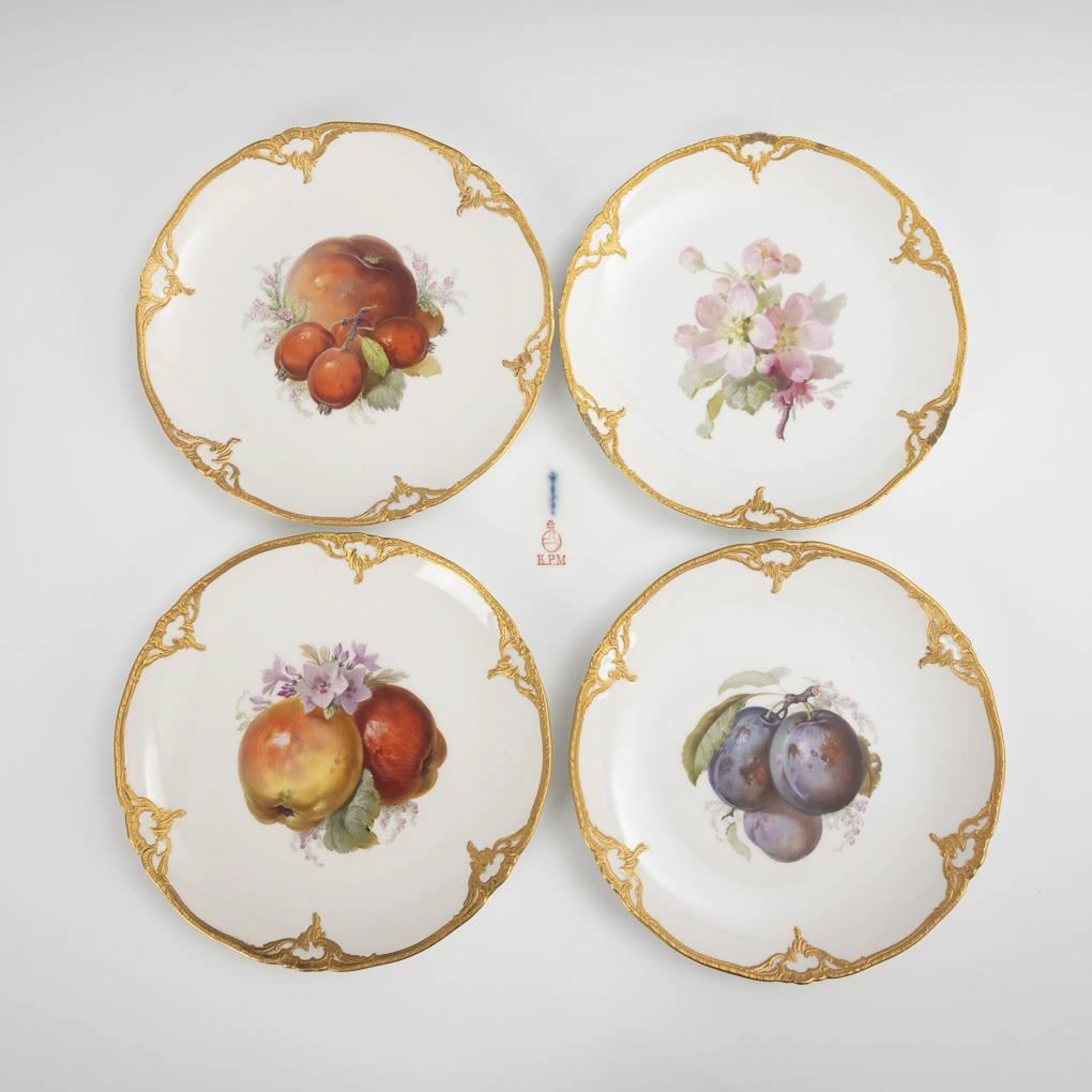 3 plates with fruit designs + 1 plate with floral designs. KPM Berlin.
