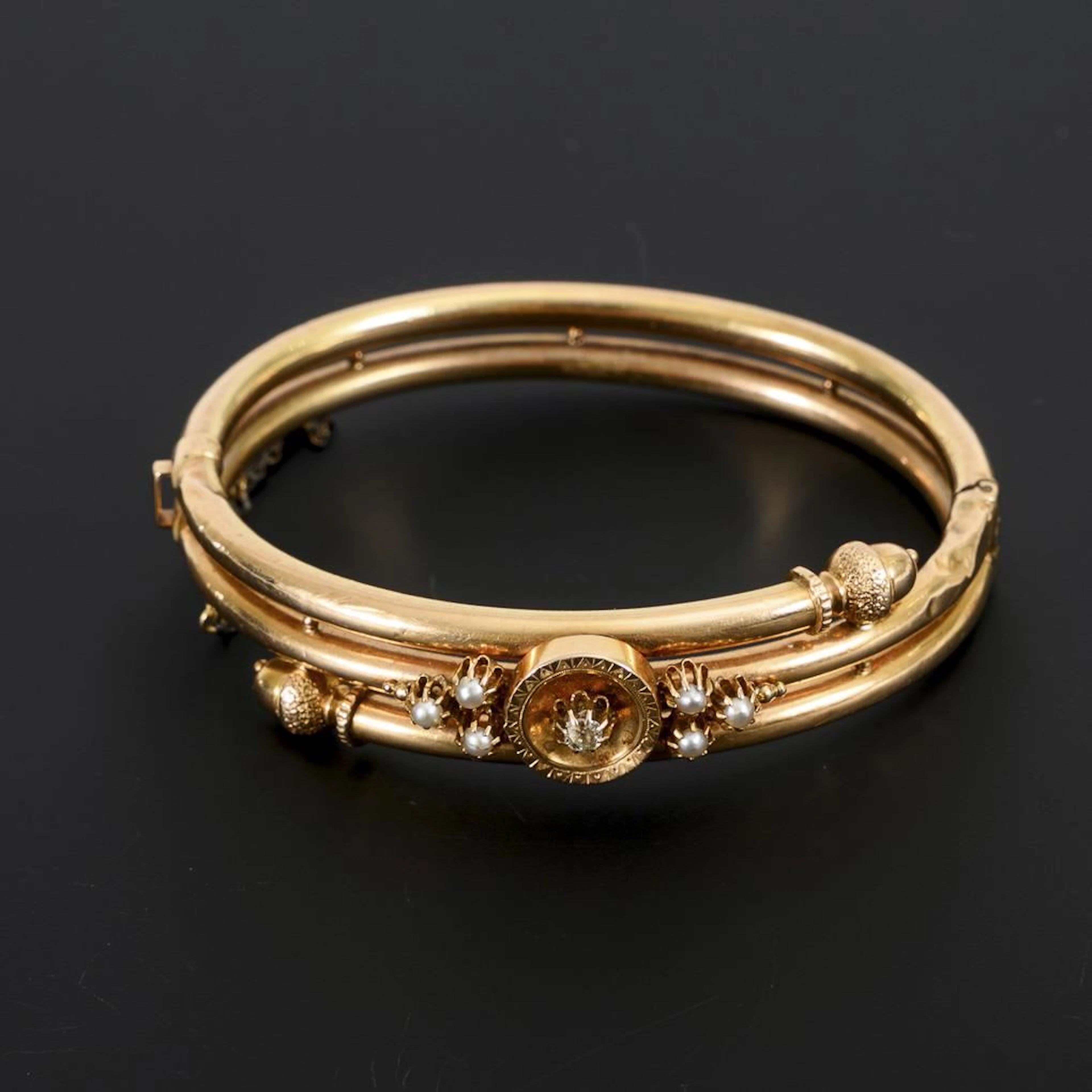 Historic bangle with diamond and seed pearls.