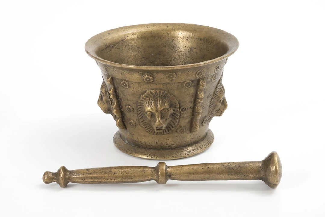 Large mortar with pestle.