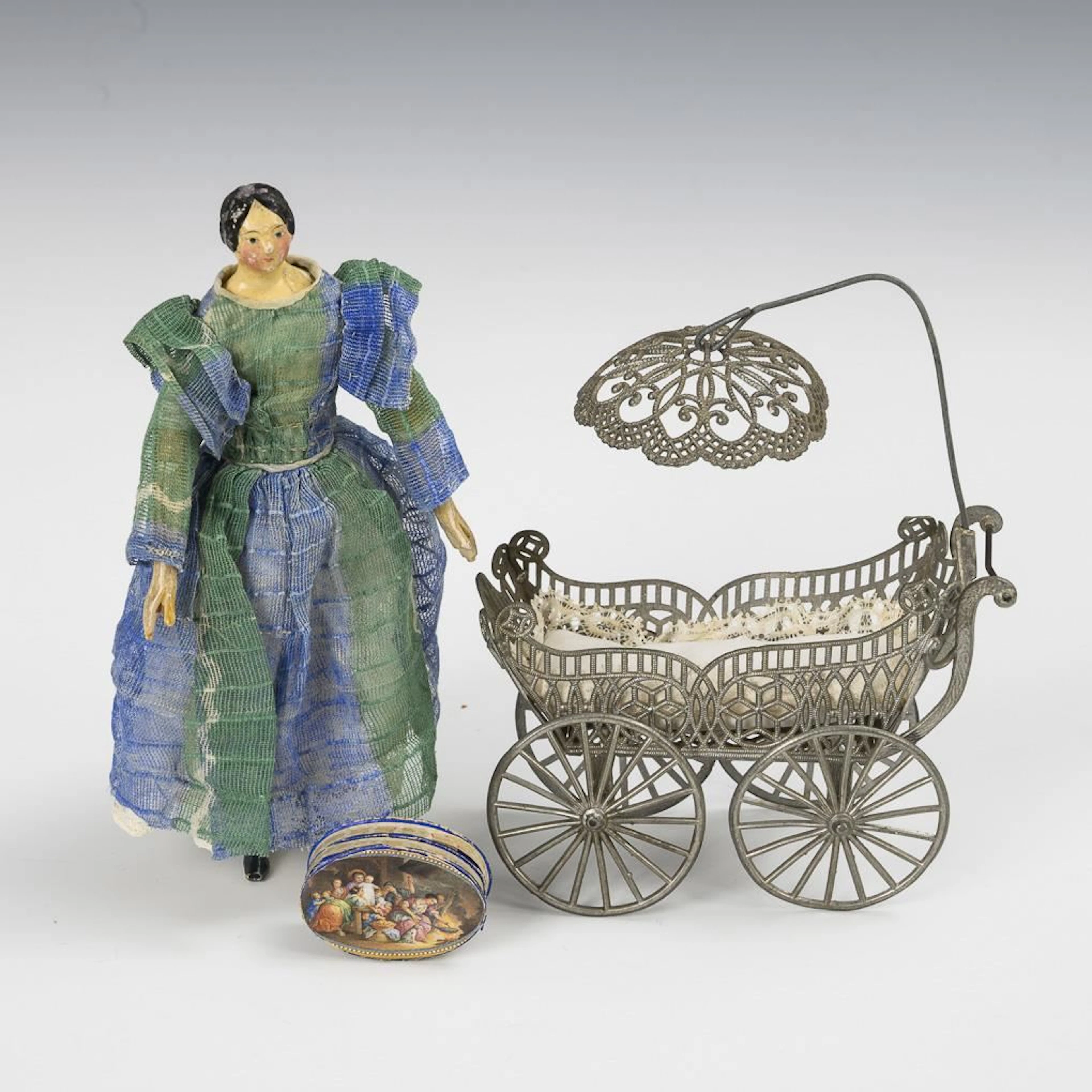 Small Biedermeier doll and doll carriage made of pewter.