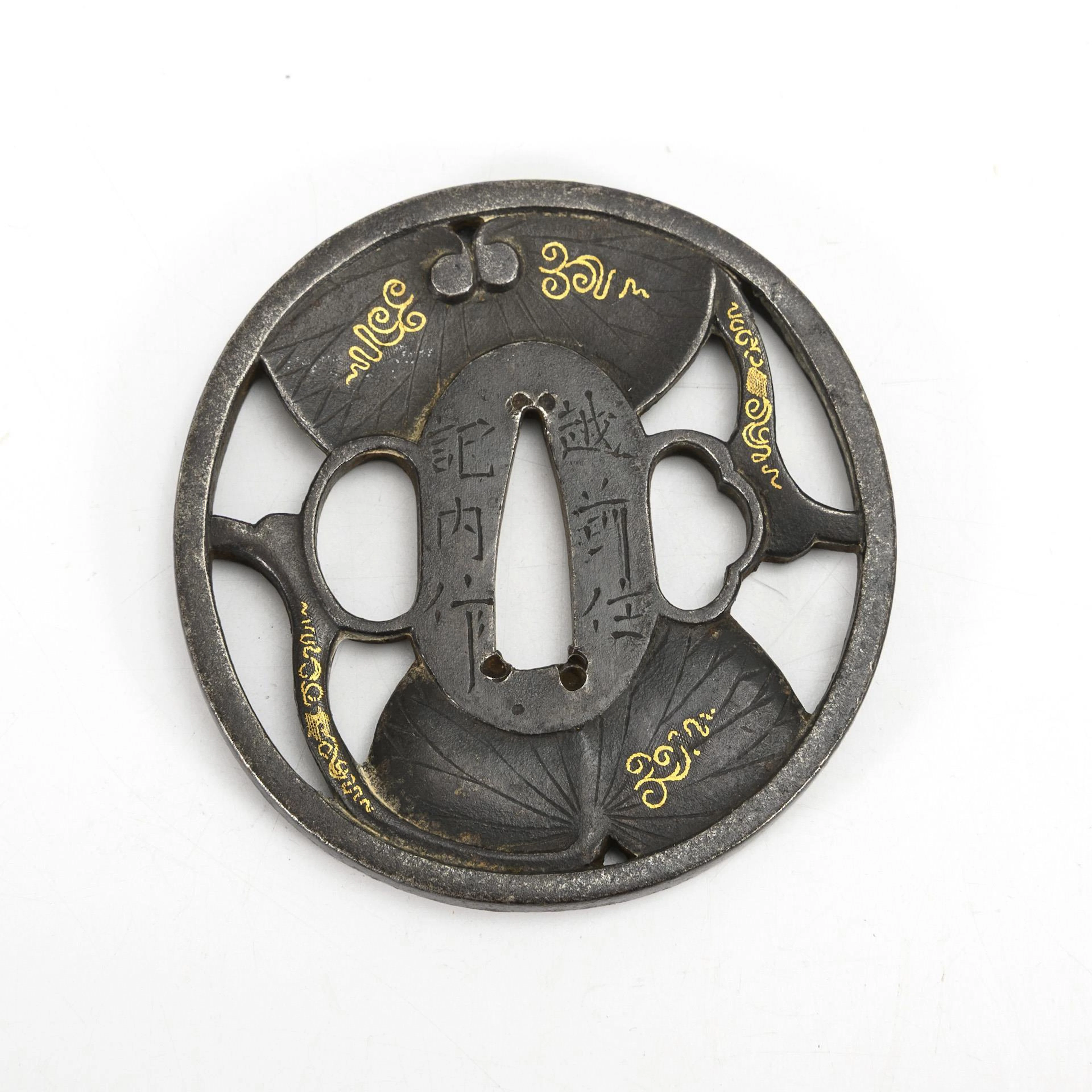Tsuba with inlaid gold threads.