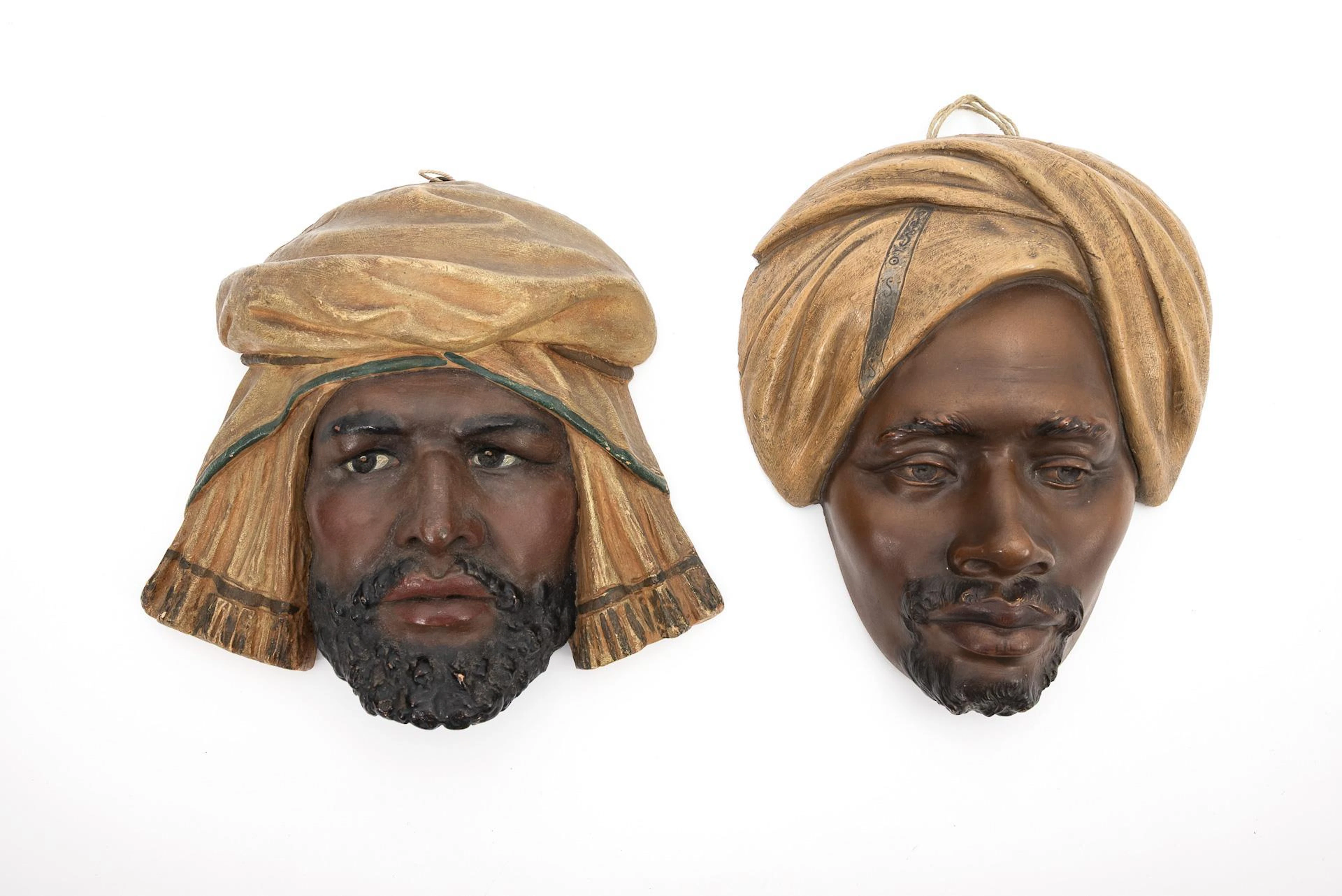 2 Art Nouveau terracotta wall masks with Orientals. Viennese manufactory