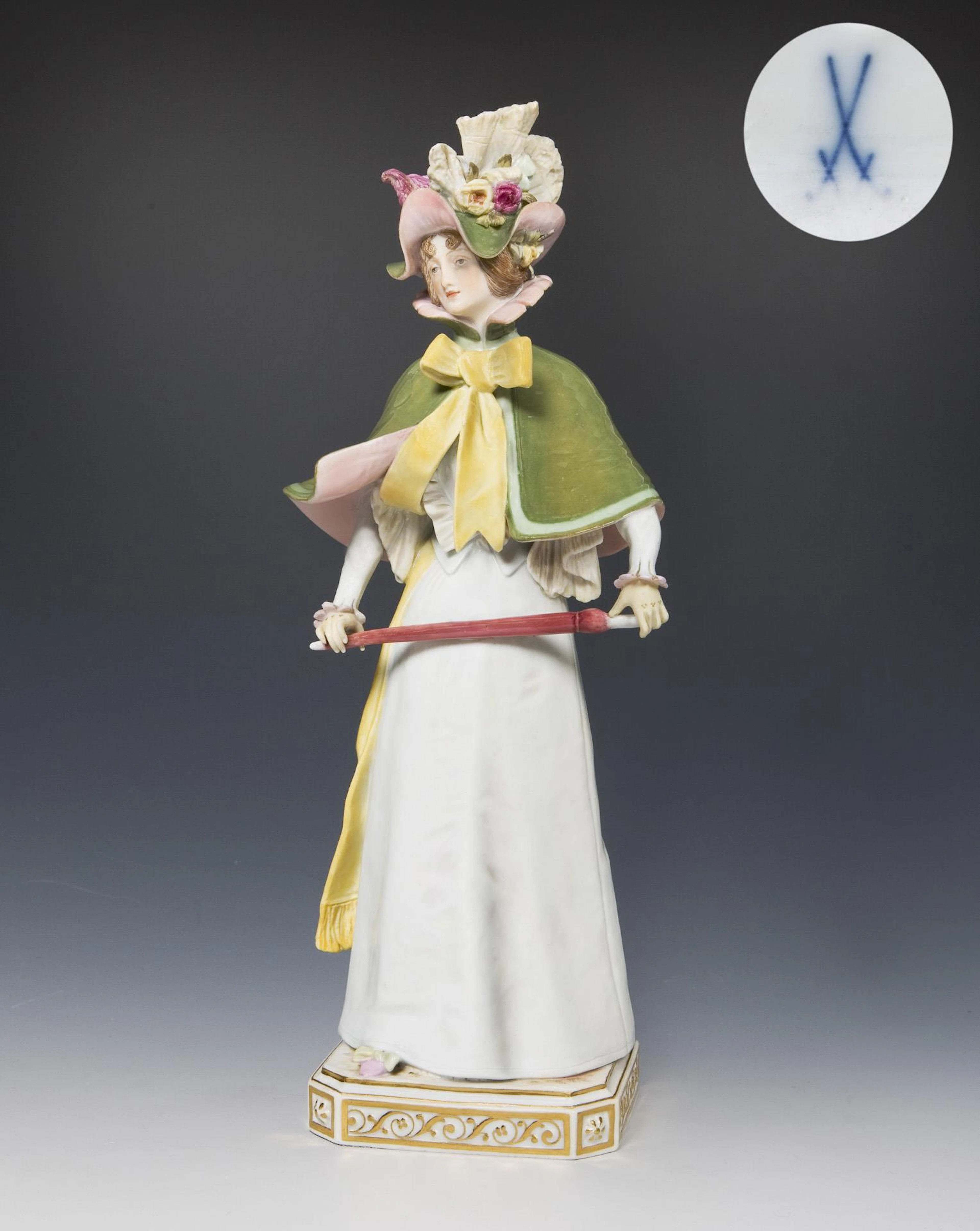 Art Nouveau figurine: lady with cane umbrella, cape and hat. Meissen.