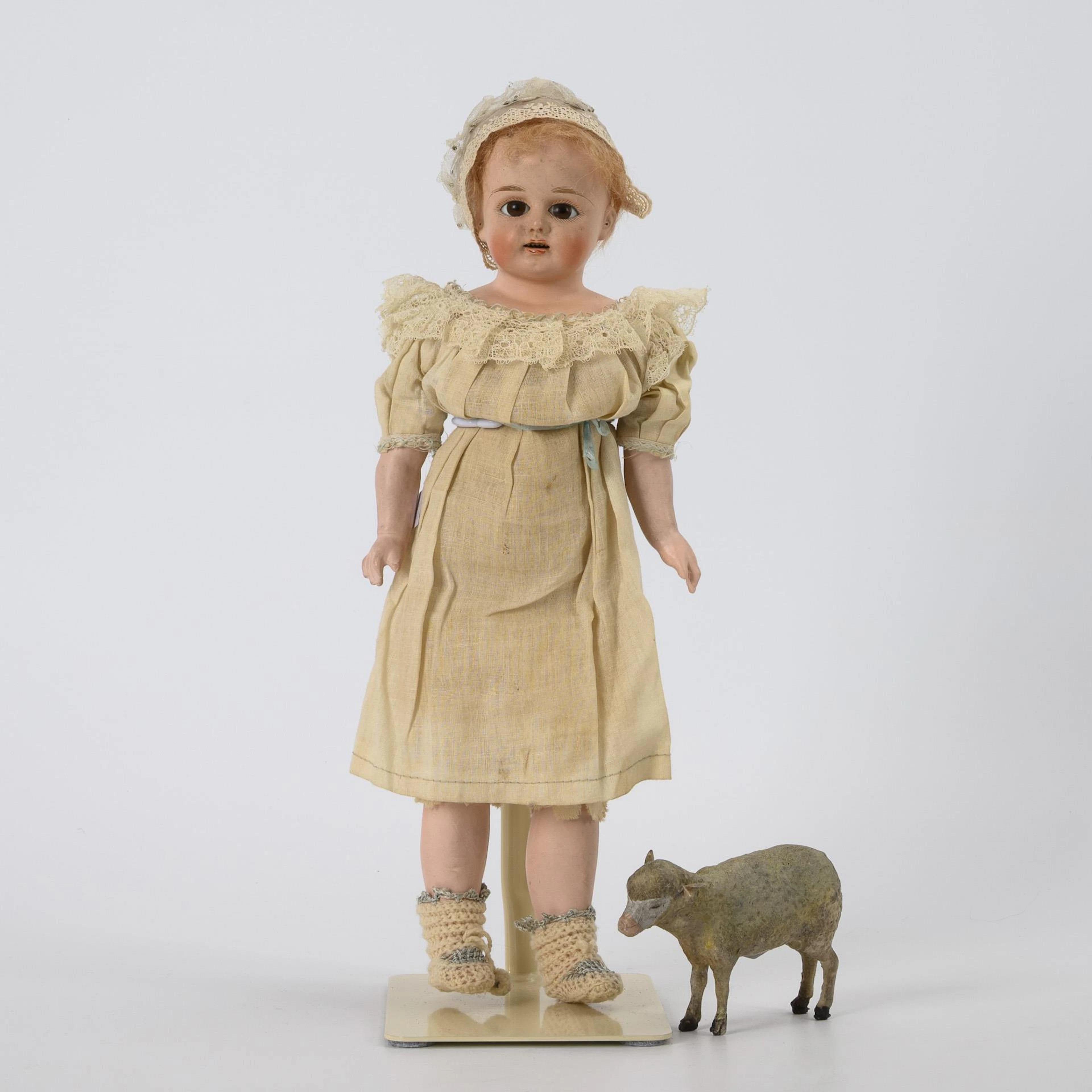 Sonneberg mass head doll with sheep.