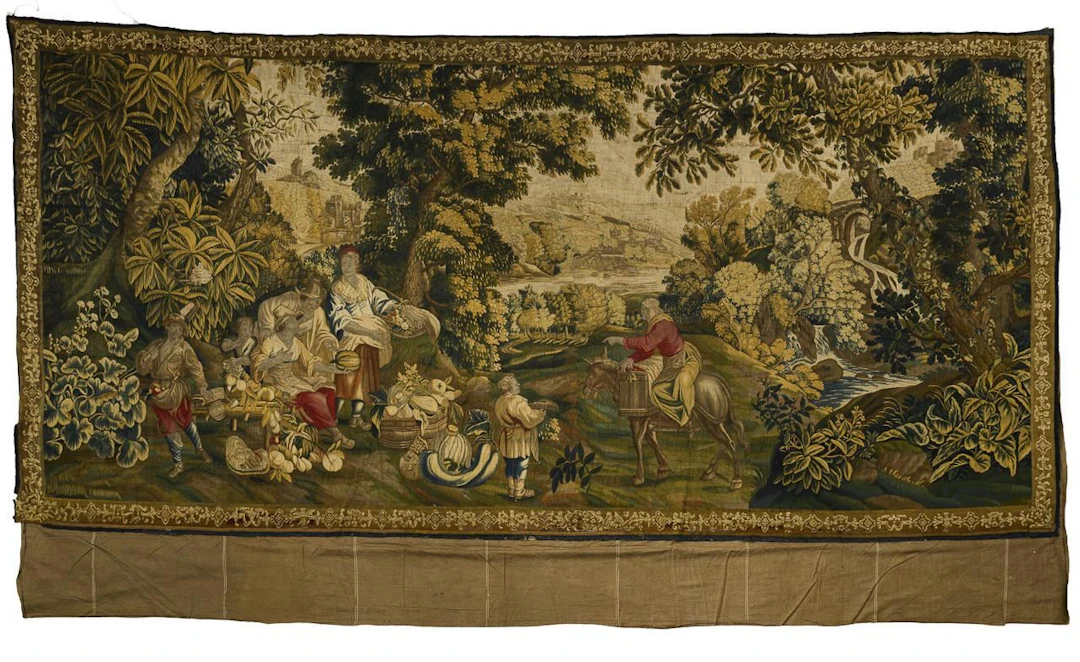 Large tapestry with a border of foliage.