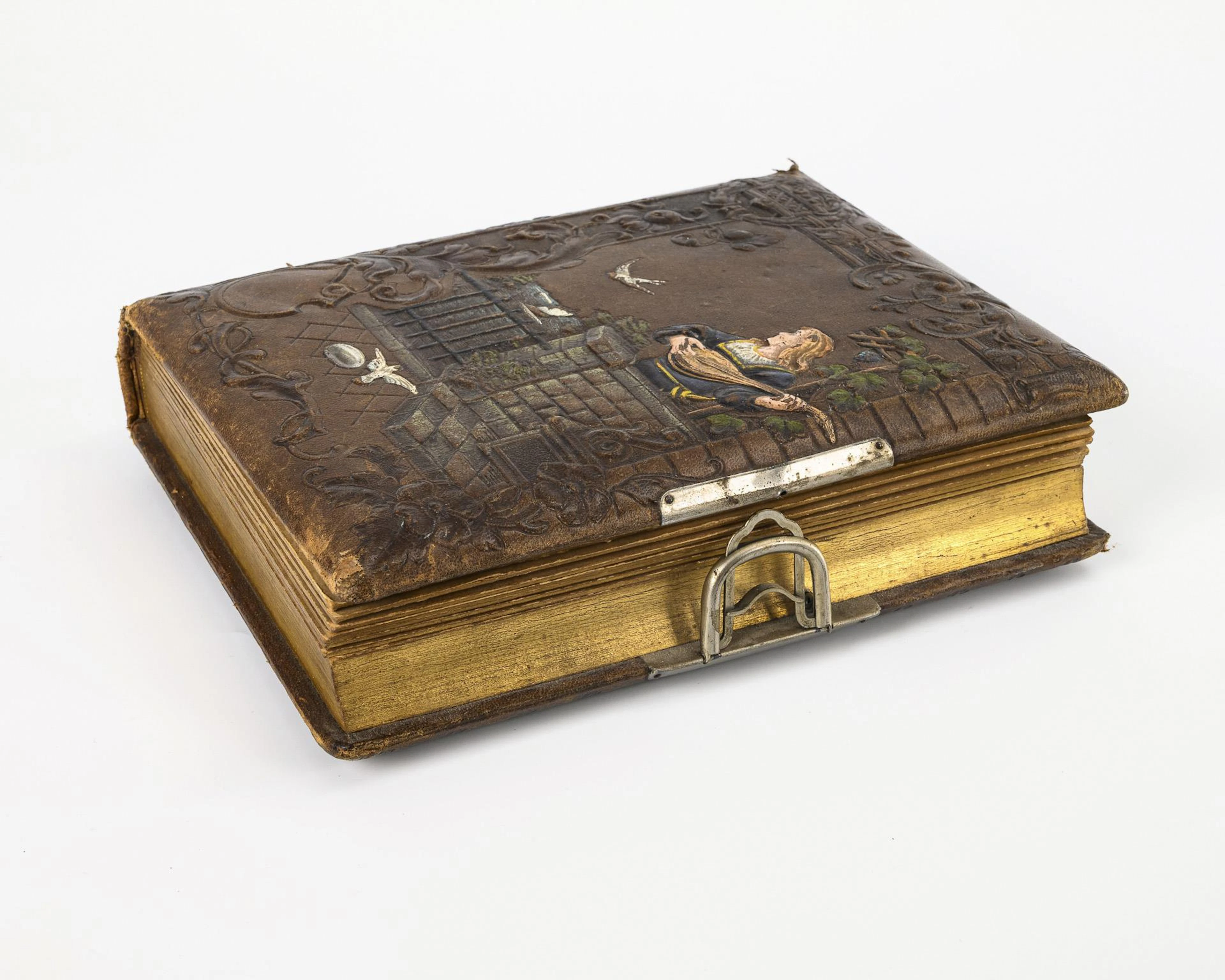 Old postcard album with music box and military photos.