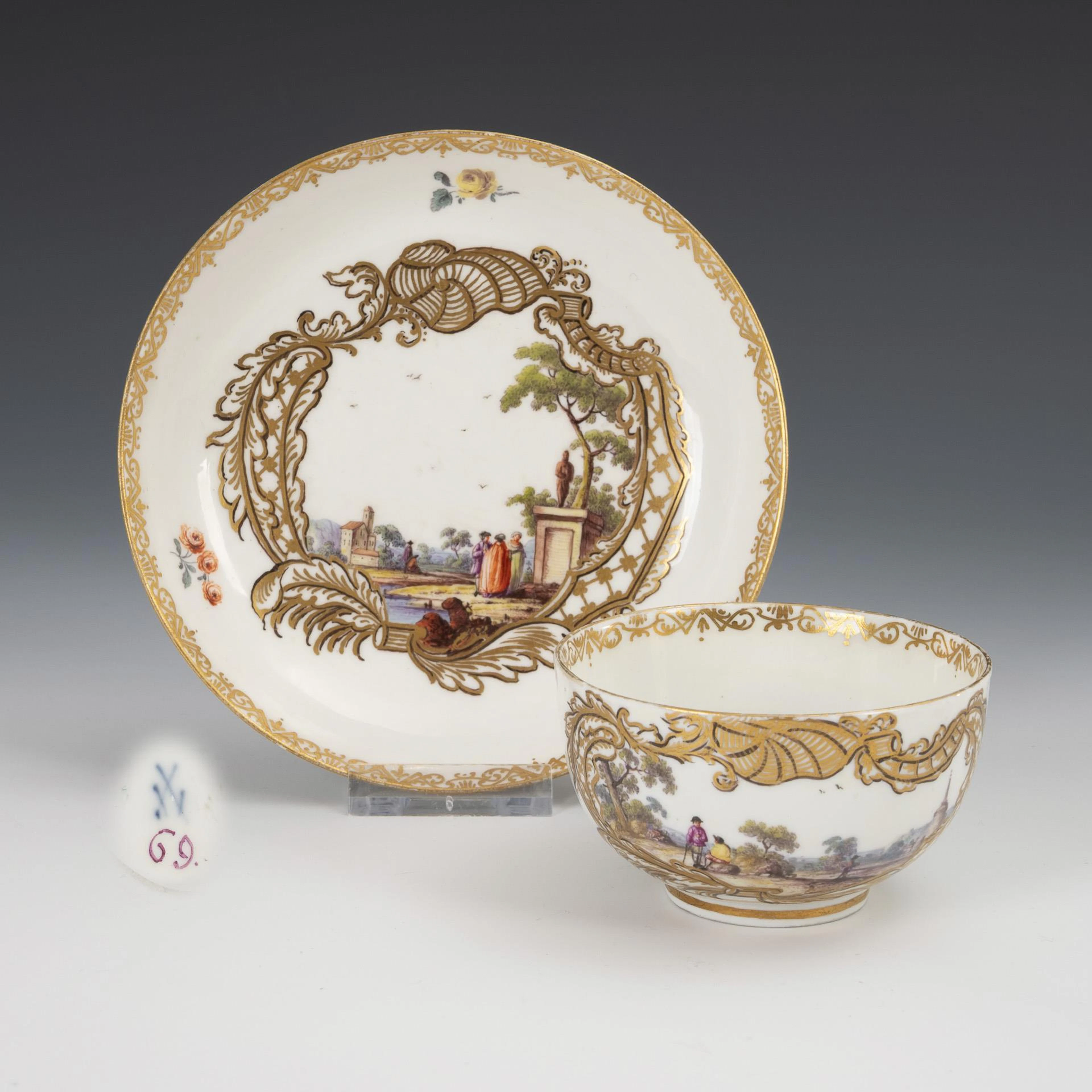 Baroque cup with landscape and figure painting. Meissen.