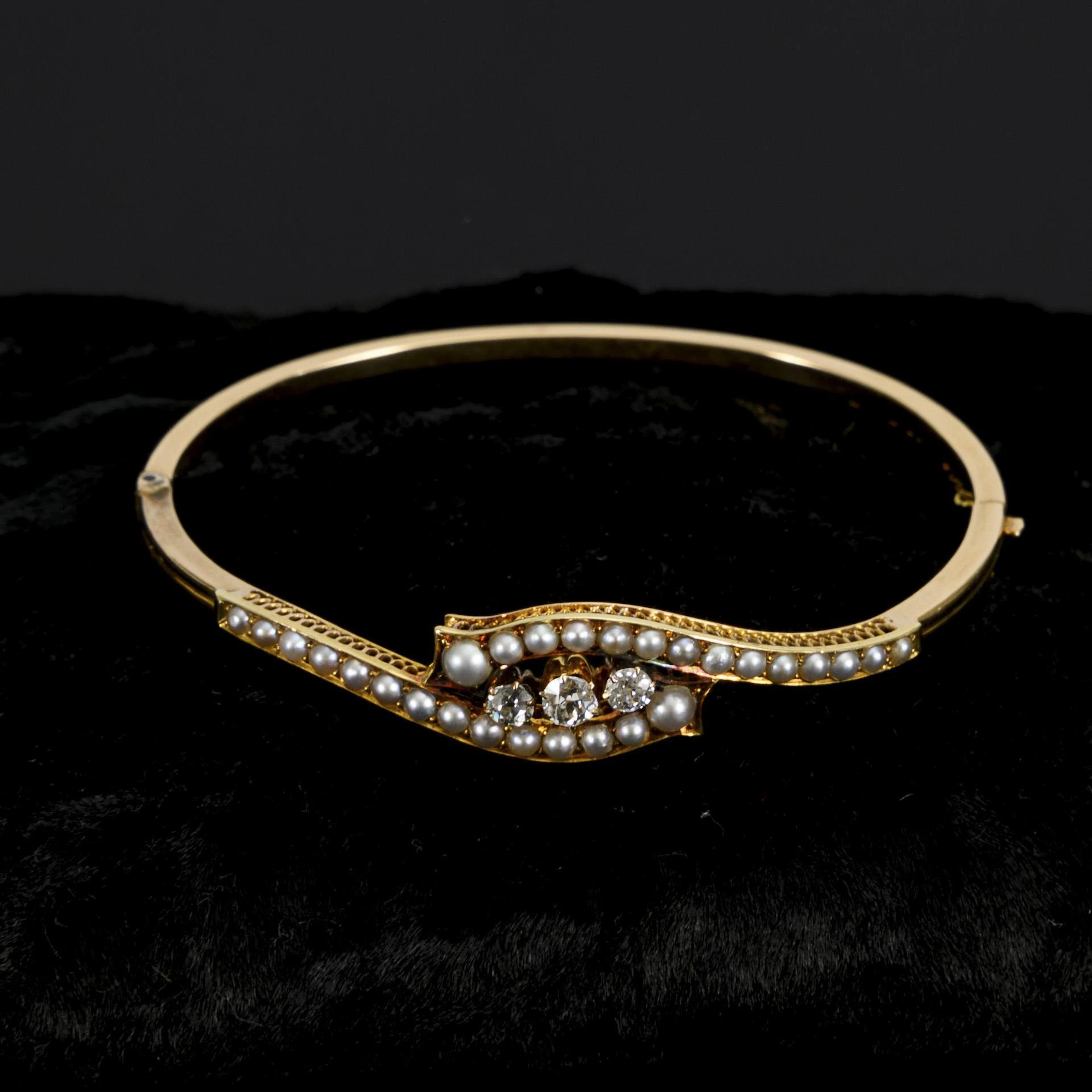 Bangle with old-cut diamonds and pearls.