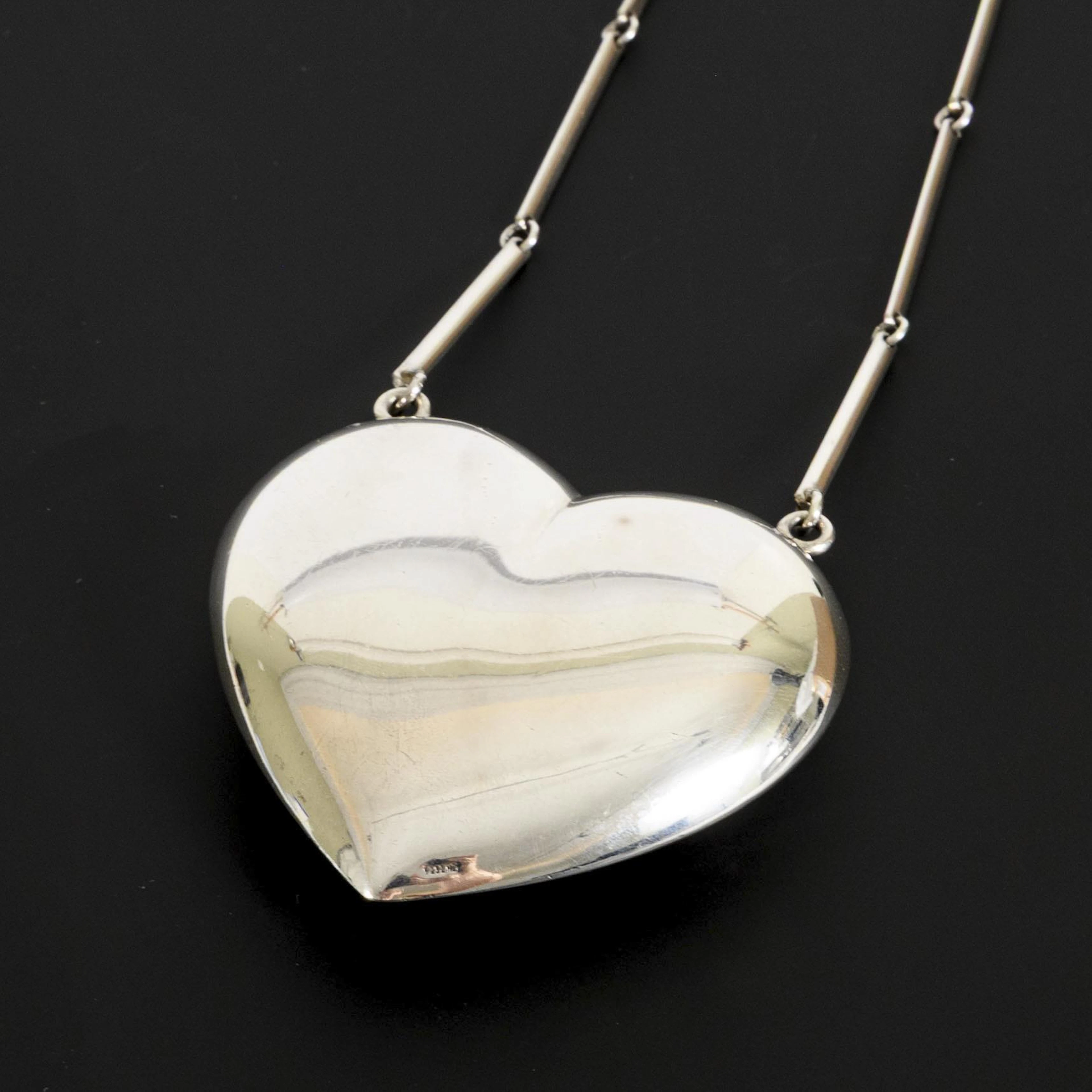 Designer necklace with large heart pendant.