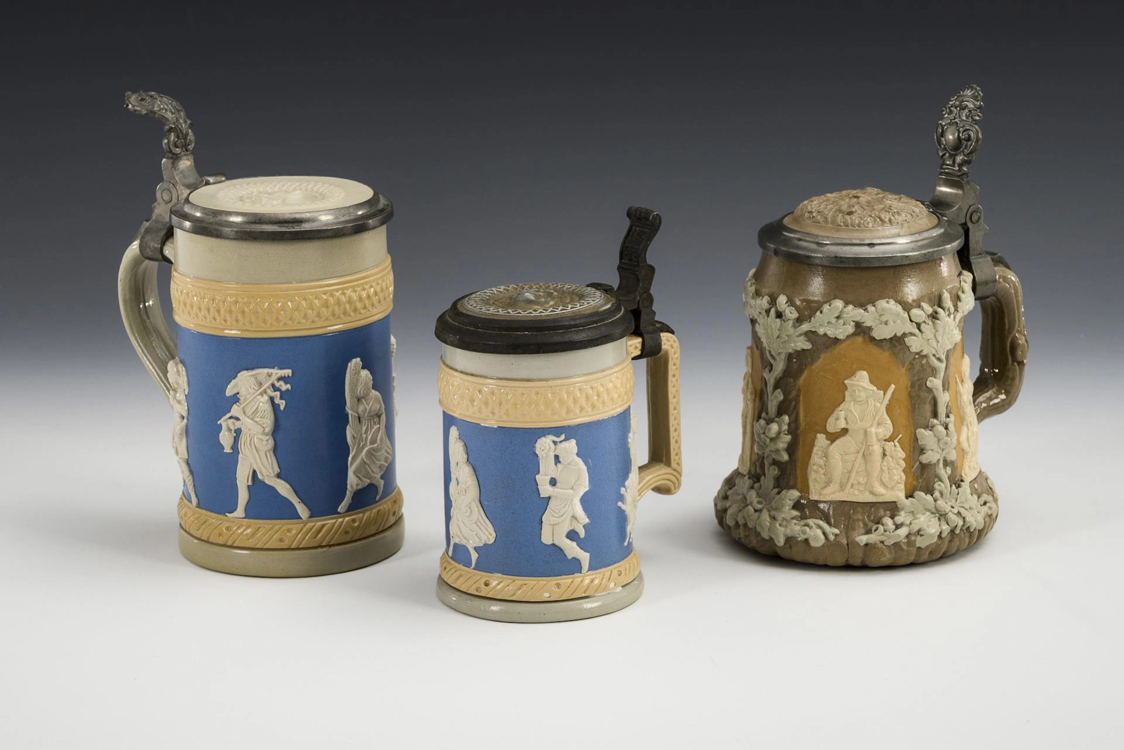 3 Mettlach lidded jugs with figural friezes. Villeroy & Boch.