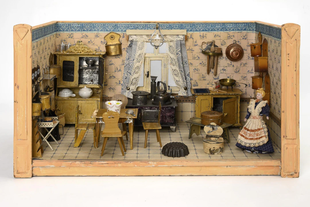 Doll kitchen with tin furniture.