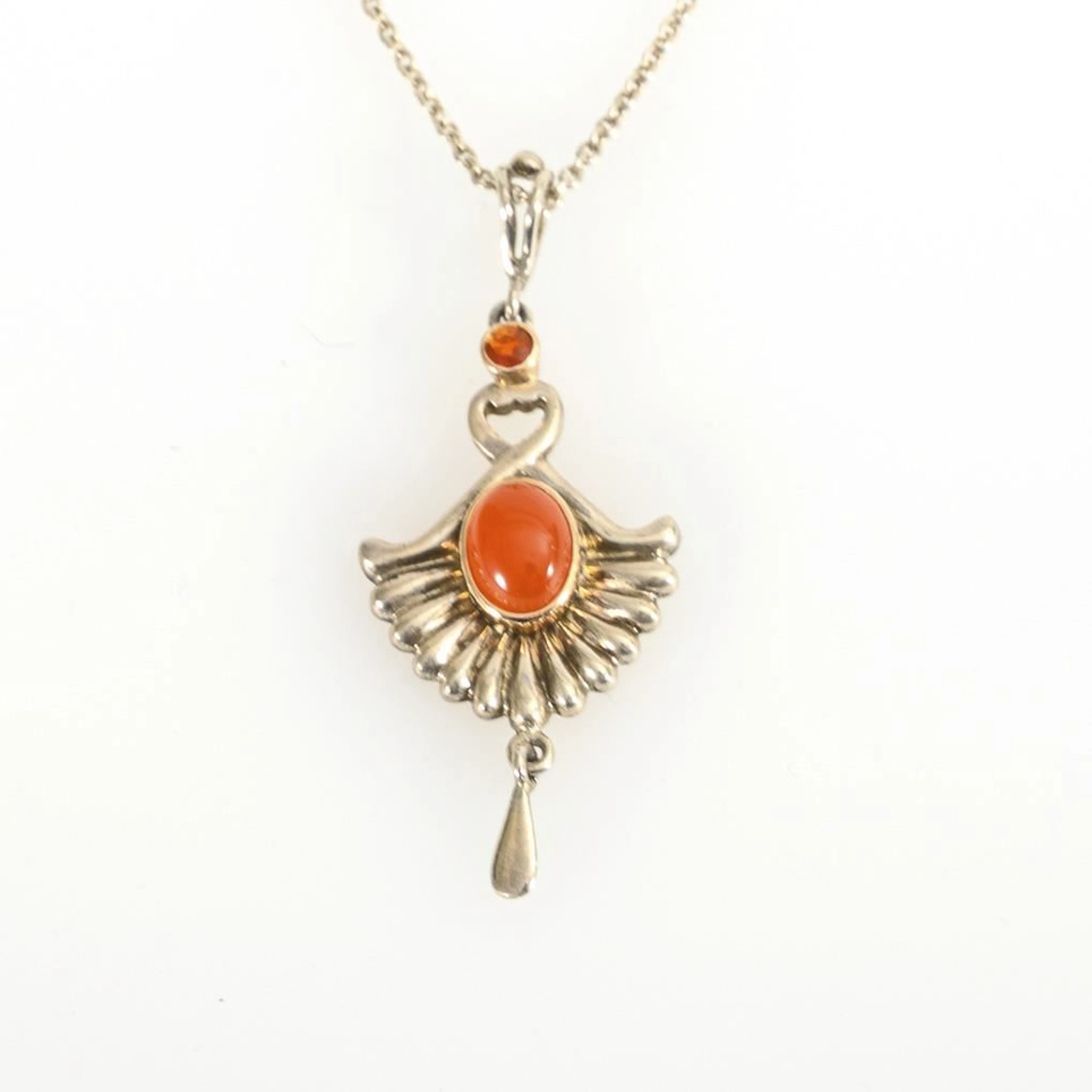 Pendant with fire opals on a chain.