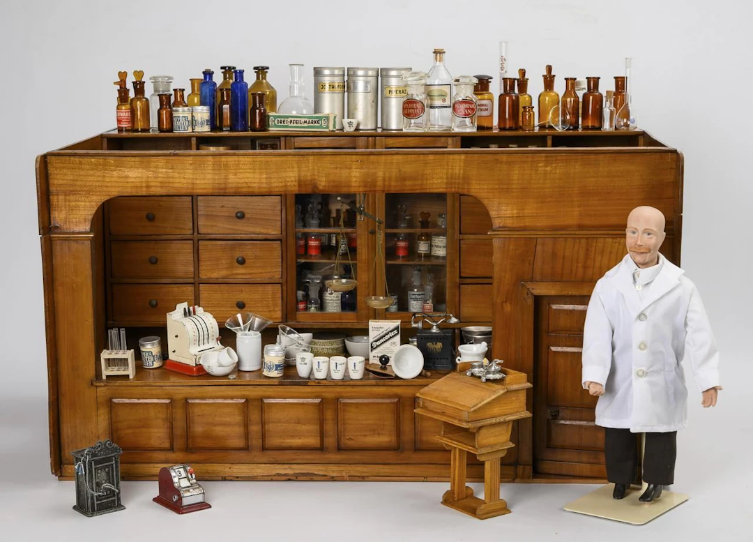 Antique, richly furnished dollhouse pharmacy.