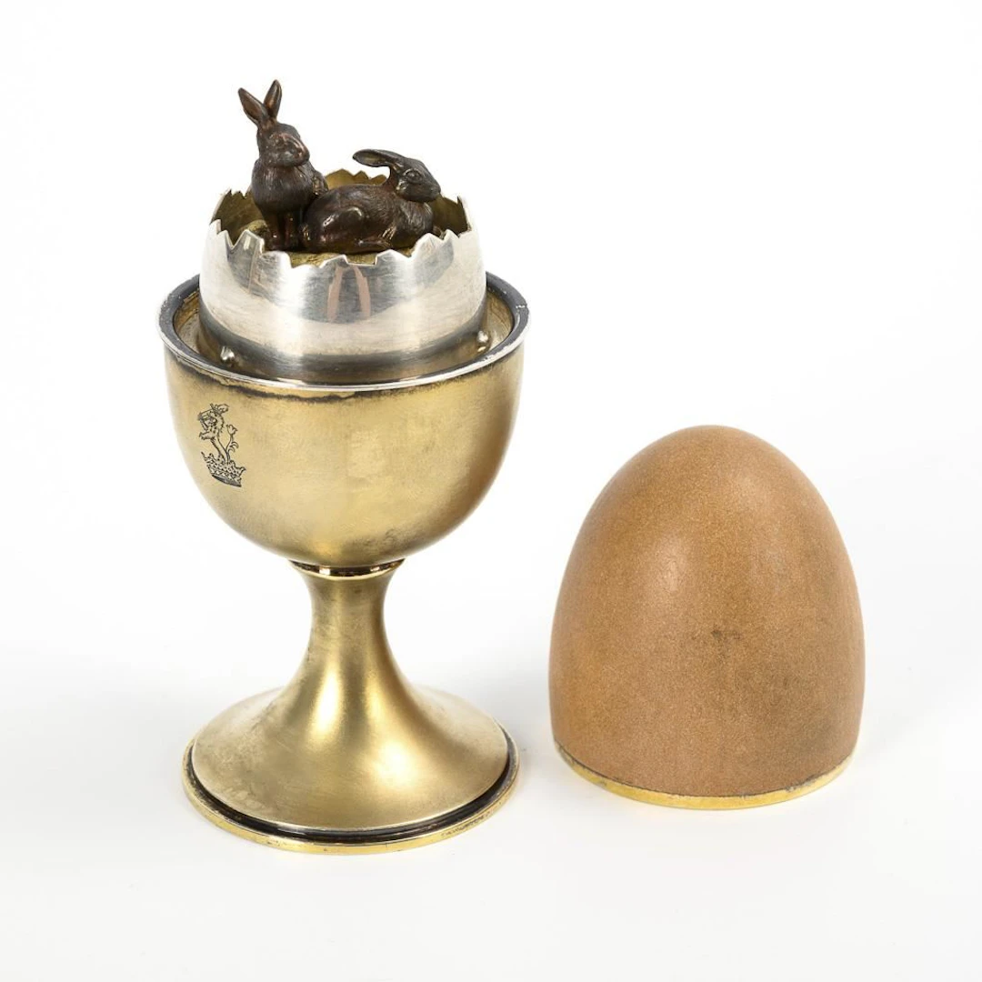 Music box: Silver egg cup with rabbits.