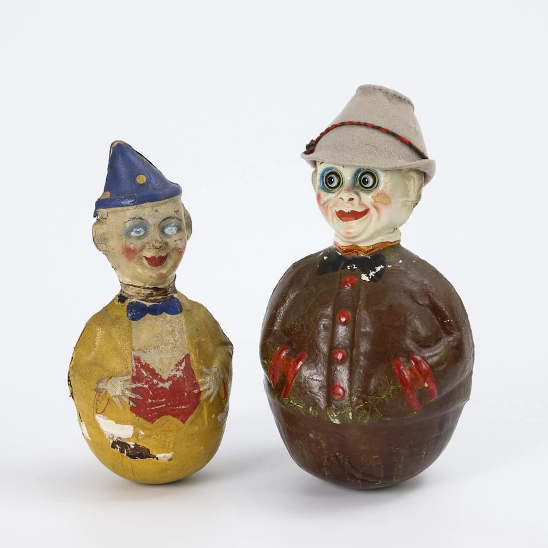 2 old roly-poly toys. In the style of Schoenhut.