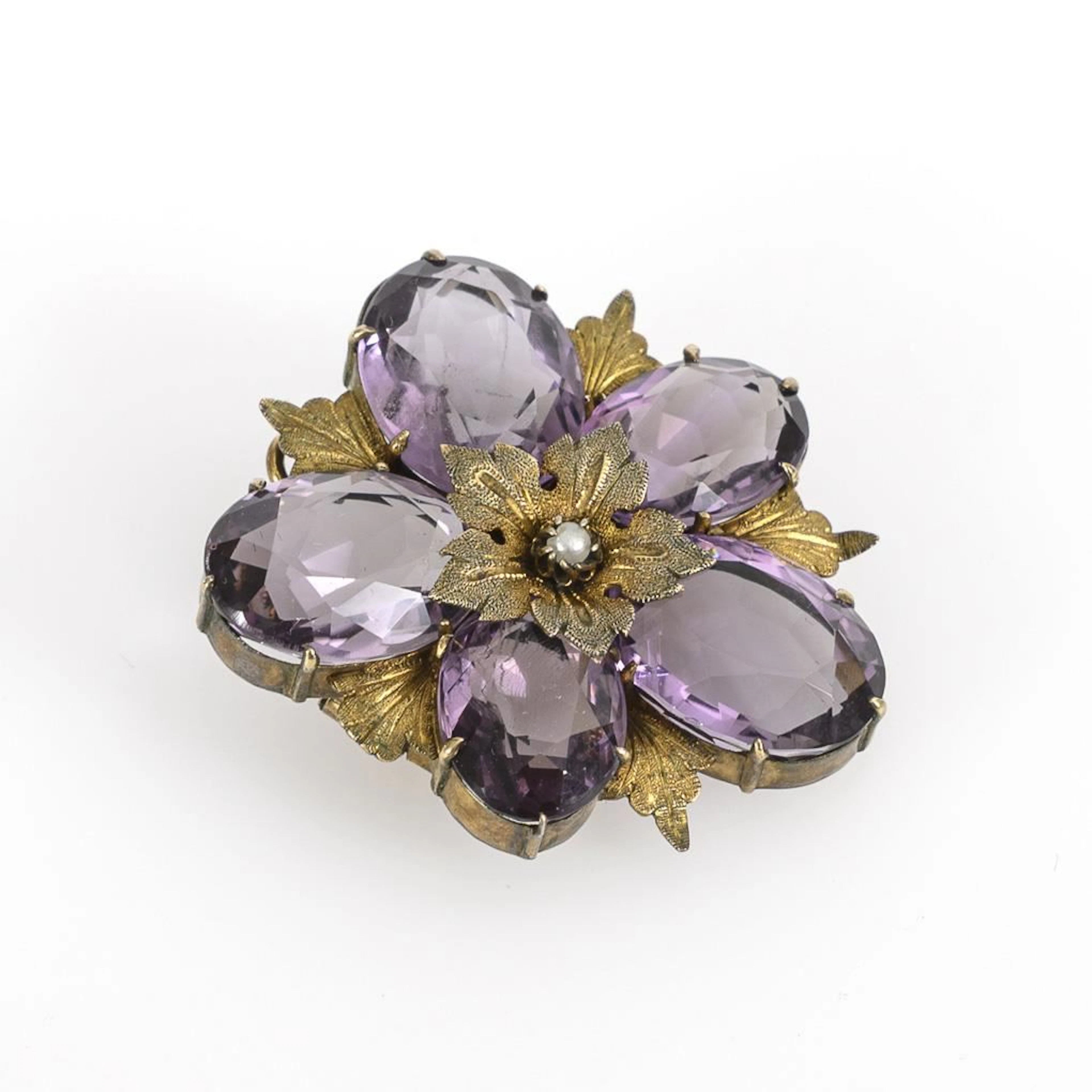 Antique brooch in the shape of a violet.