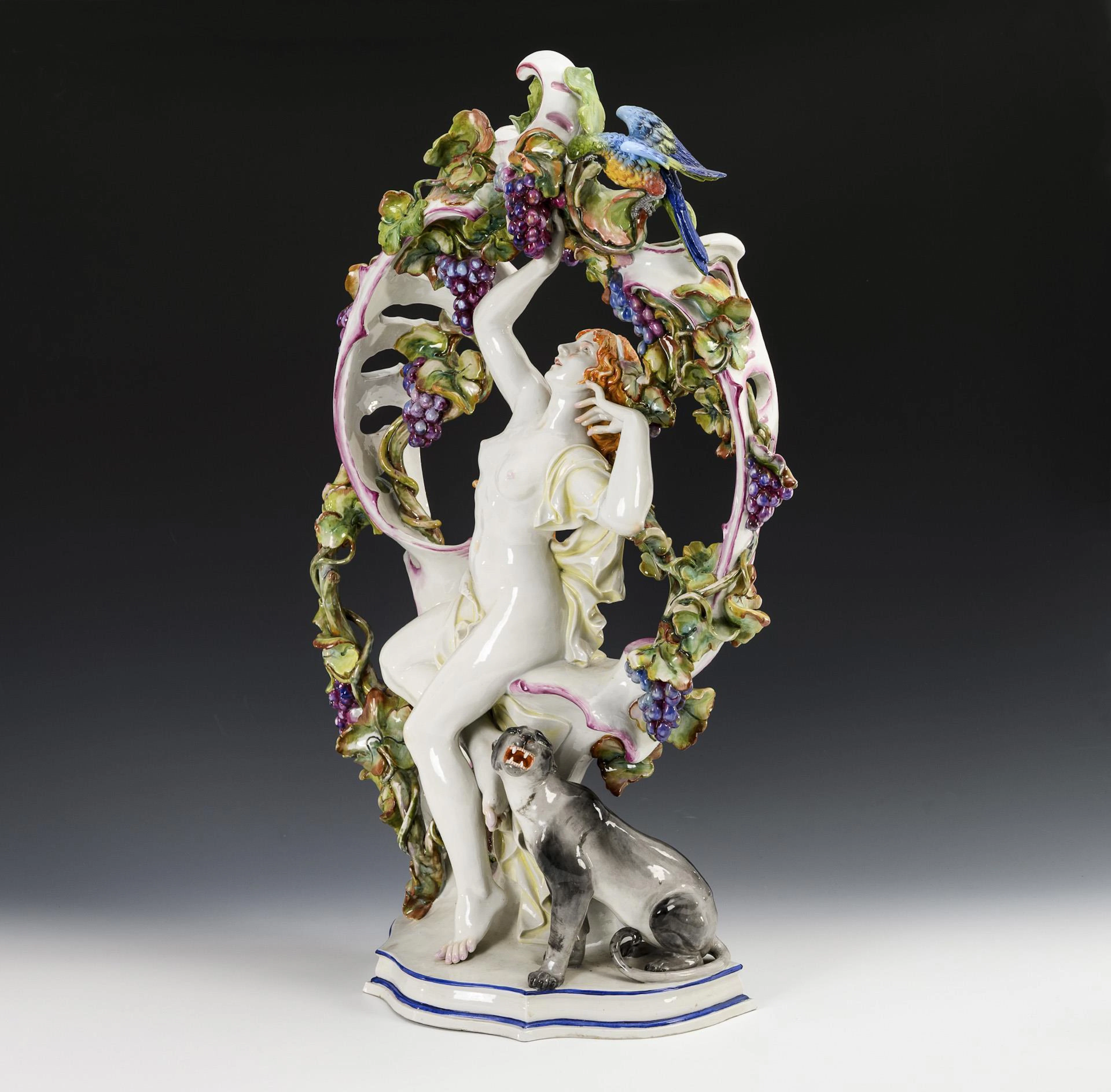 Large sculpture: female nude in vines with panther.