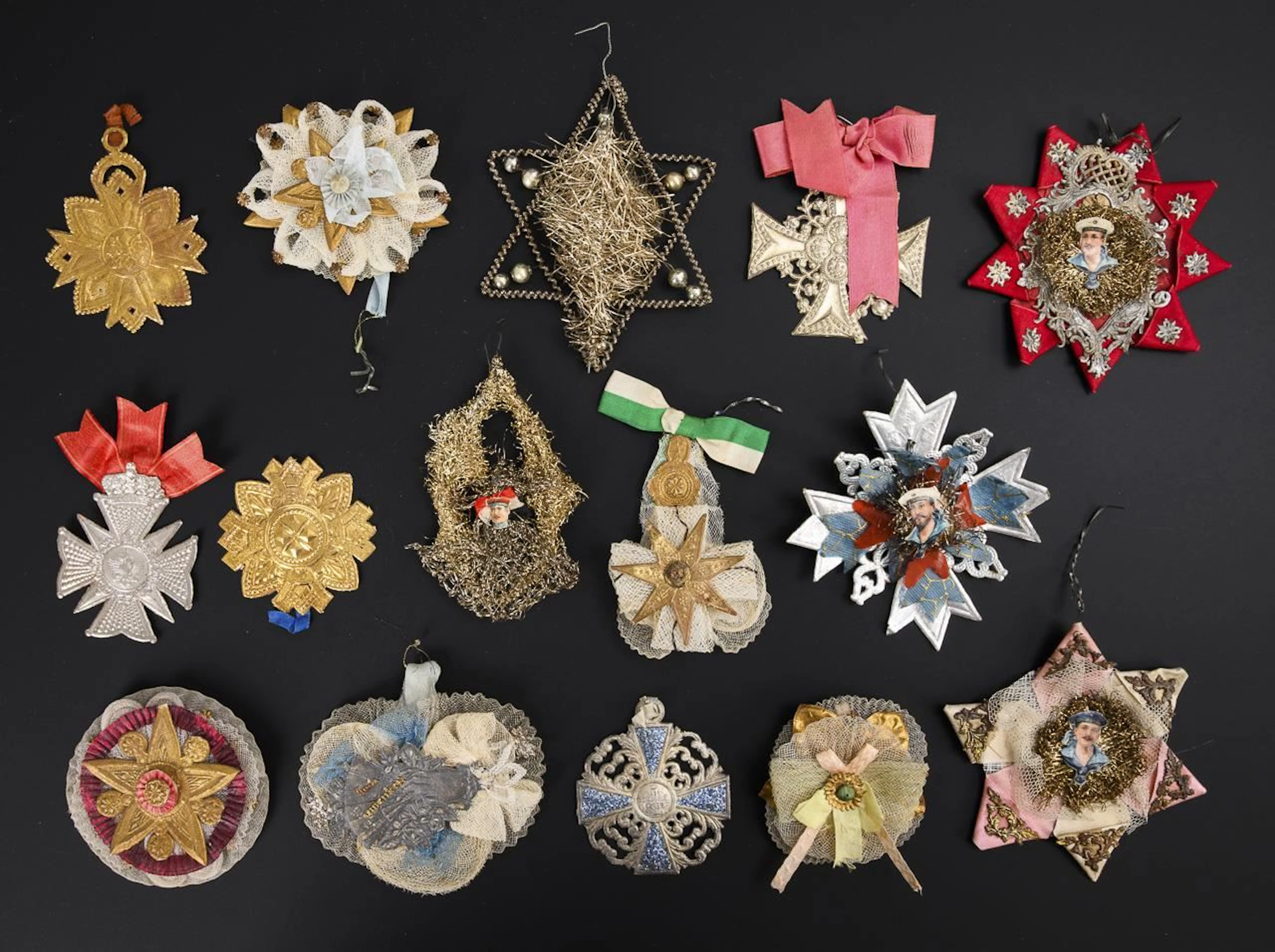Collection of 13 cotillion medals and 2 Christmas tree ornaments.
