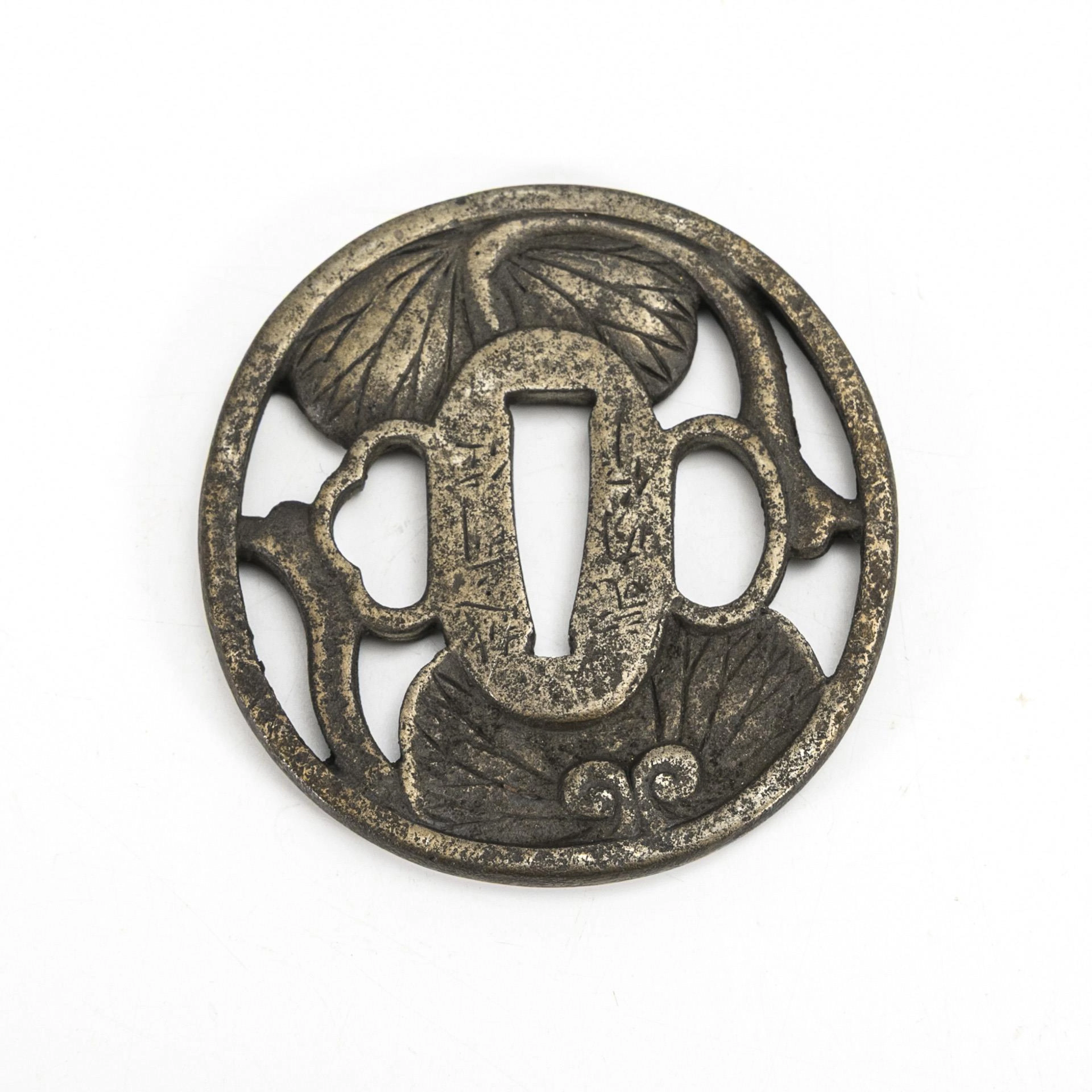 Tsuba with lotus leaves.