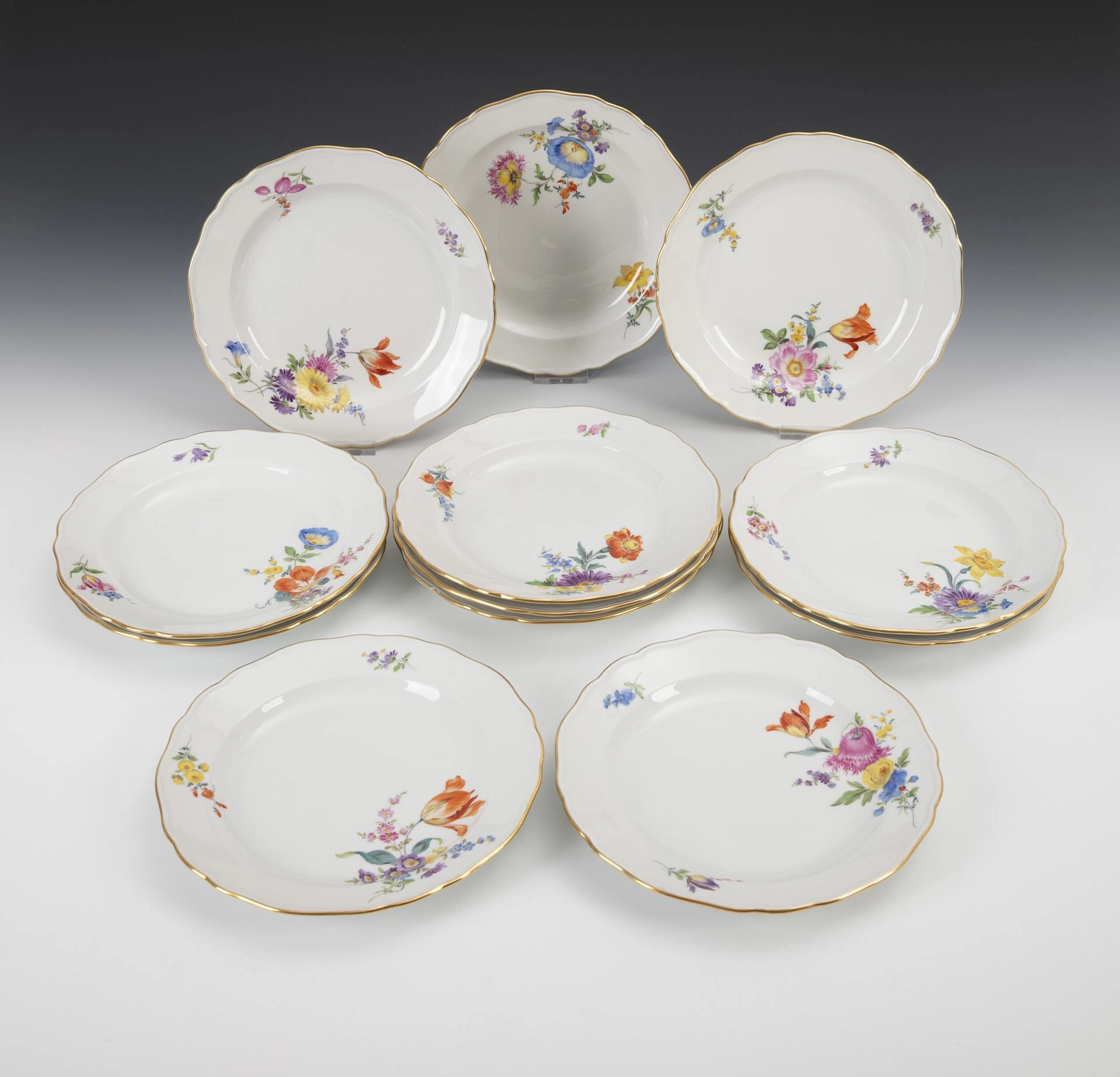 12 starter plates with flower painting. Meissen.
