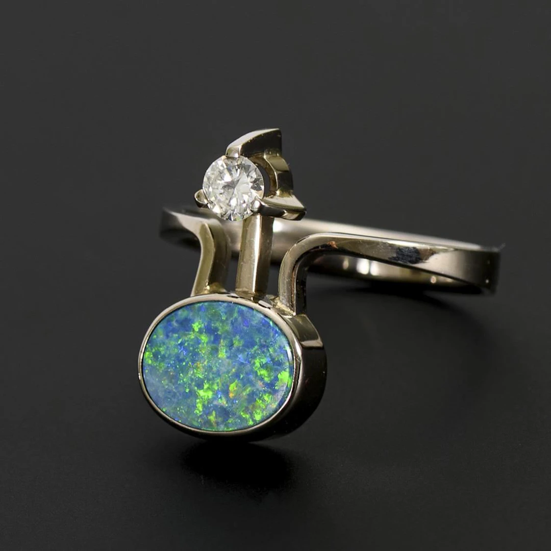 Ring with opal doublet and diamond.