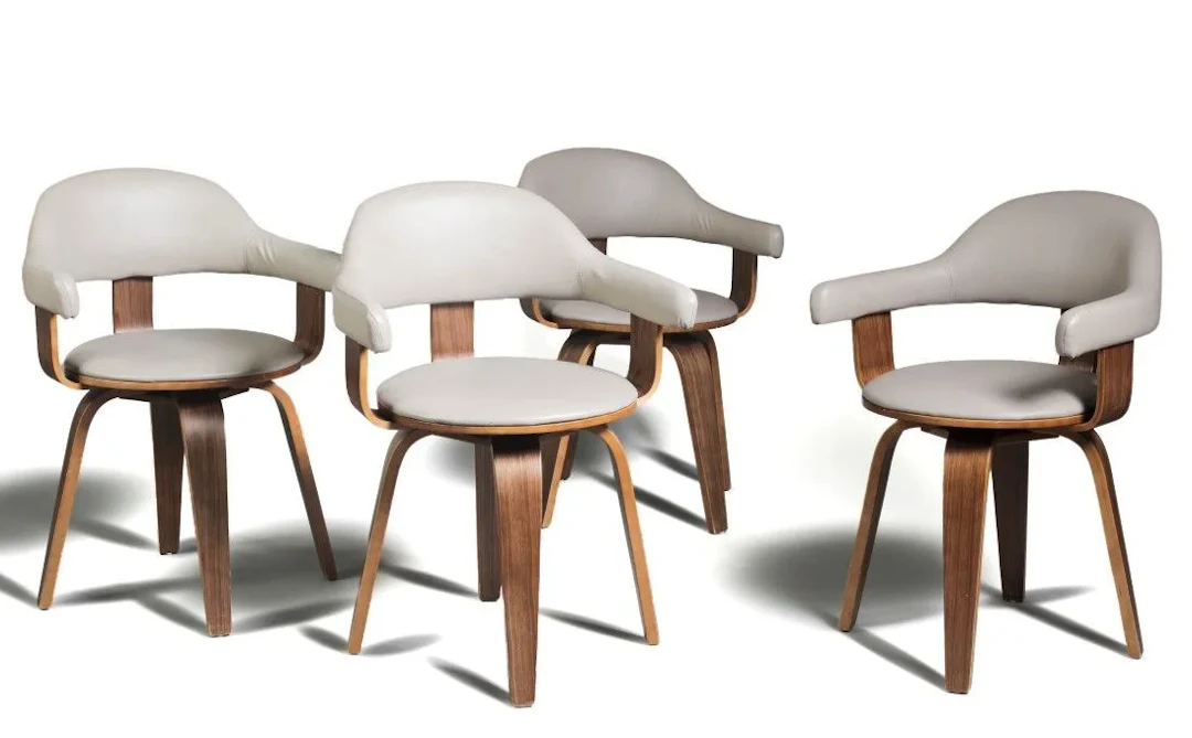 Suite de quatre fauteuils modernistes à dossiers enveloppant - Lot 382