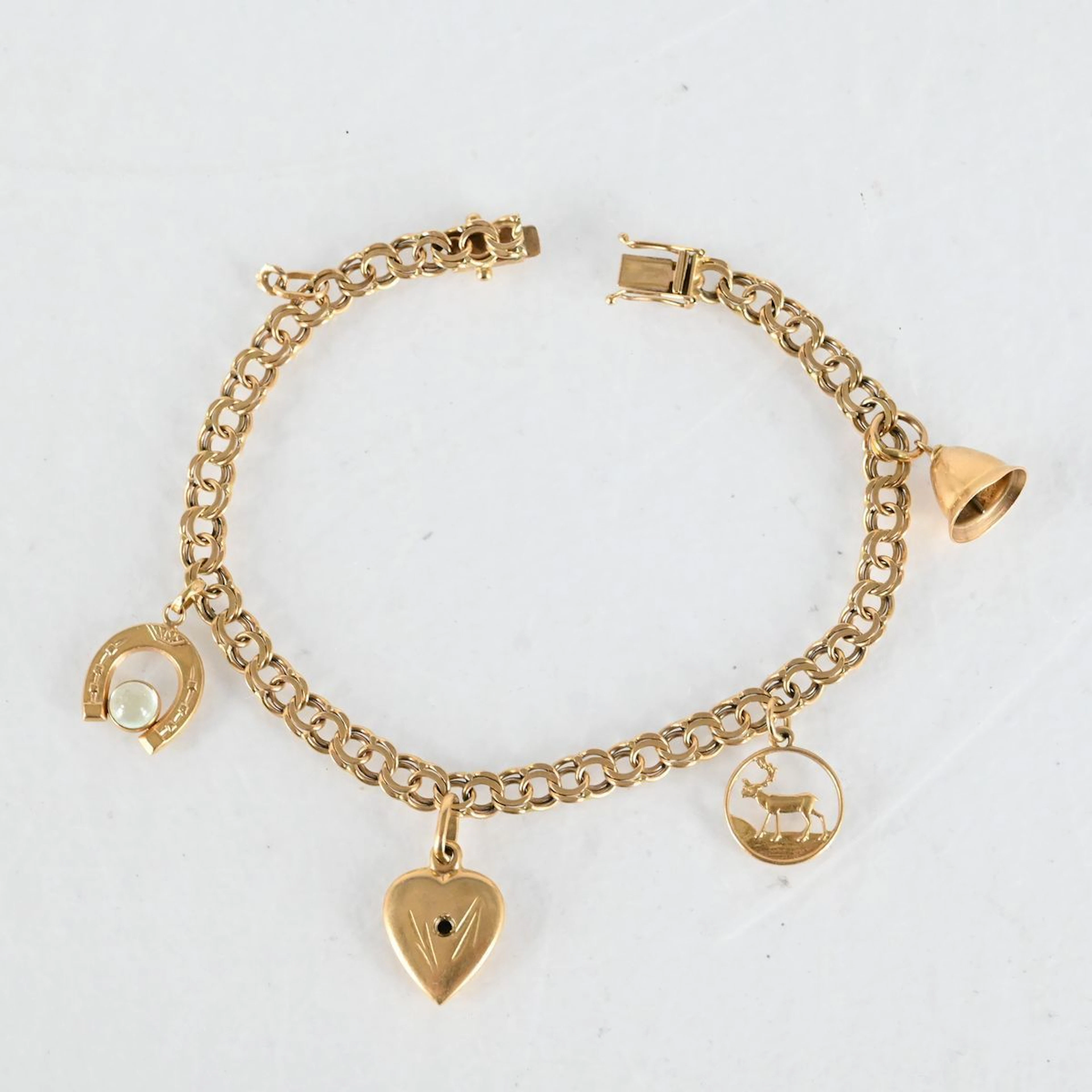 Armband med 4 berlocker "Bismarck", 18K Guld
