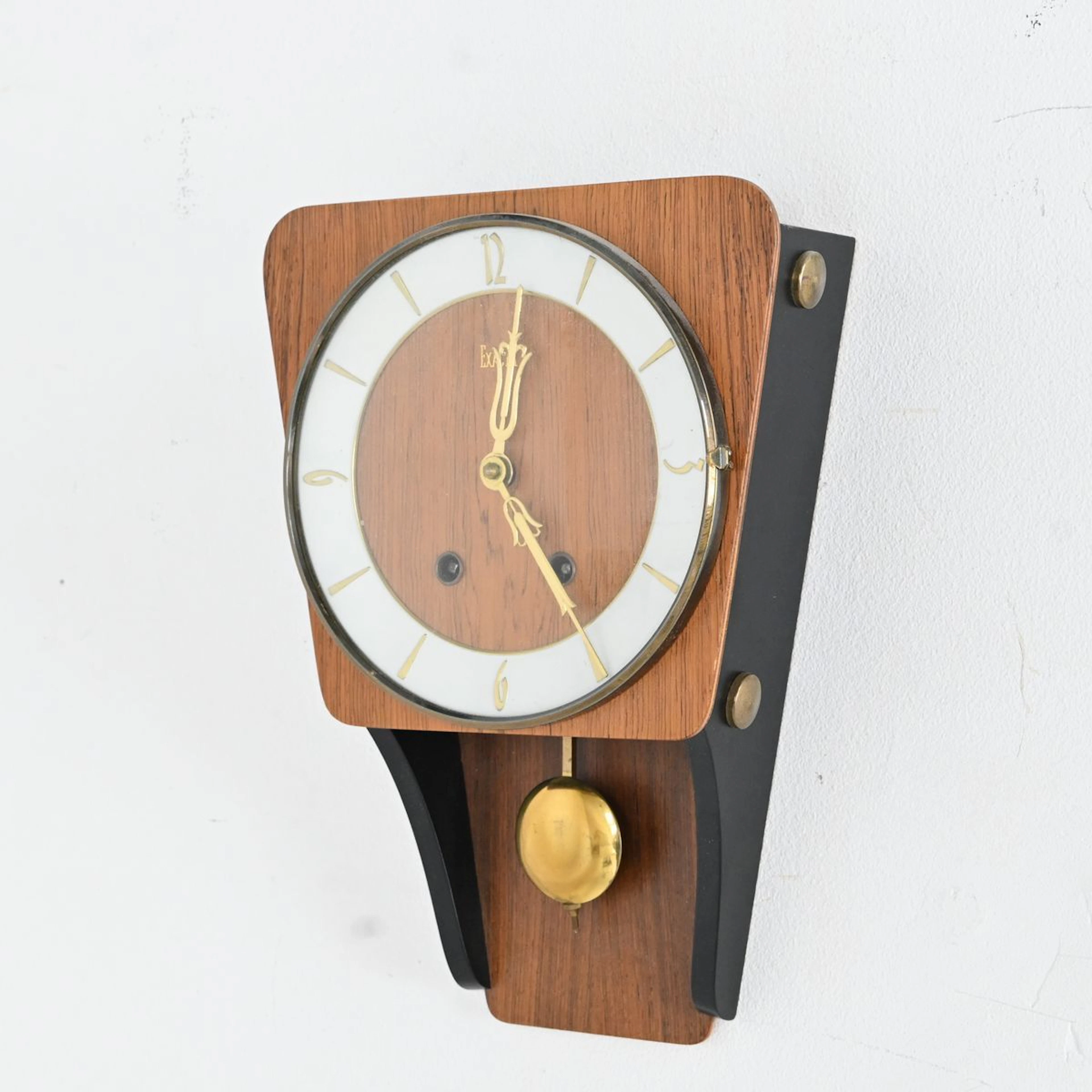 Väggur "Exacta", teak och svärtat trä, 1950 tal