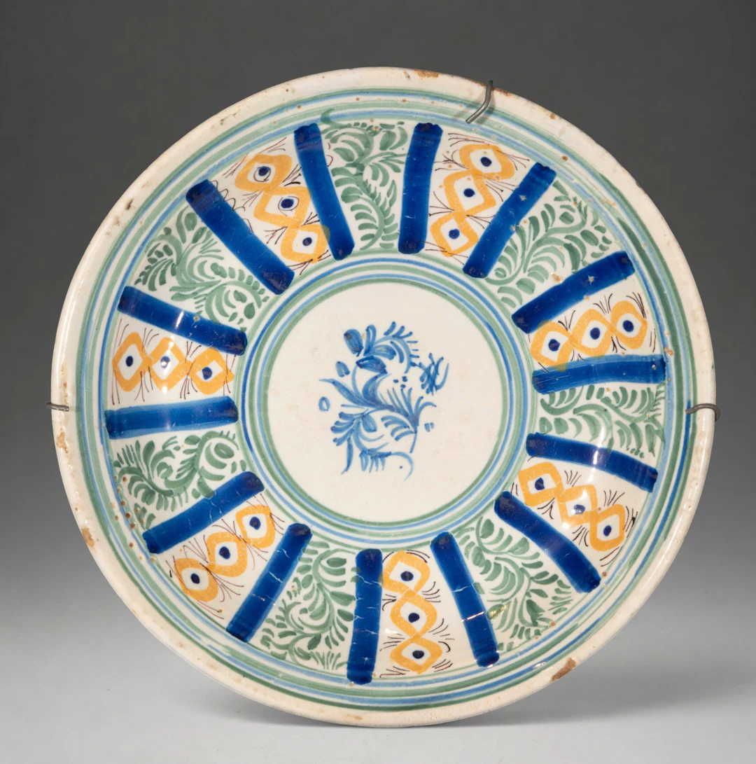 MANISES CERAMICS - Plate with polychrome floral and geometric decoration