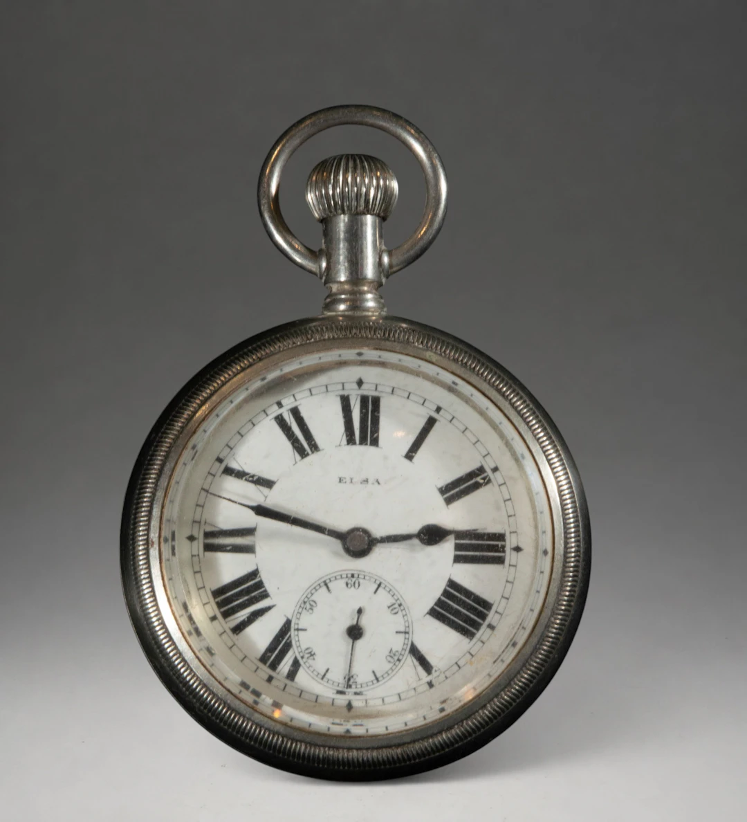 Pocket watch with Roman numerals and second hand