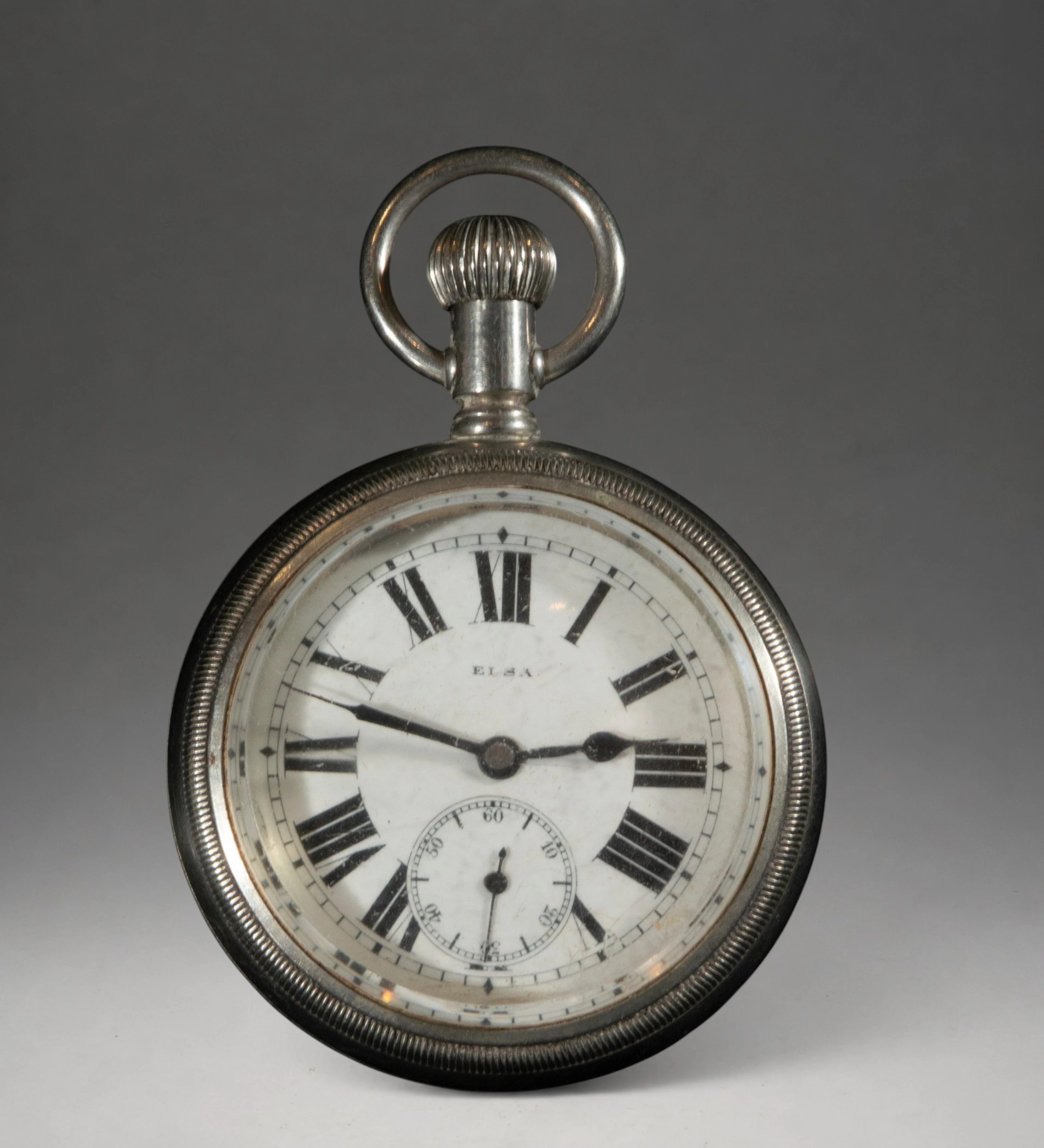 Pocket watch with Roman numerals and second hand