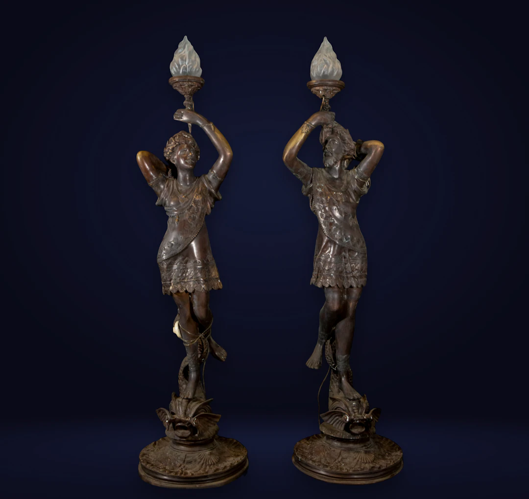 Pair of monumental Art Nouveau torch holders in patinated bronze