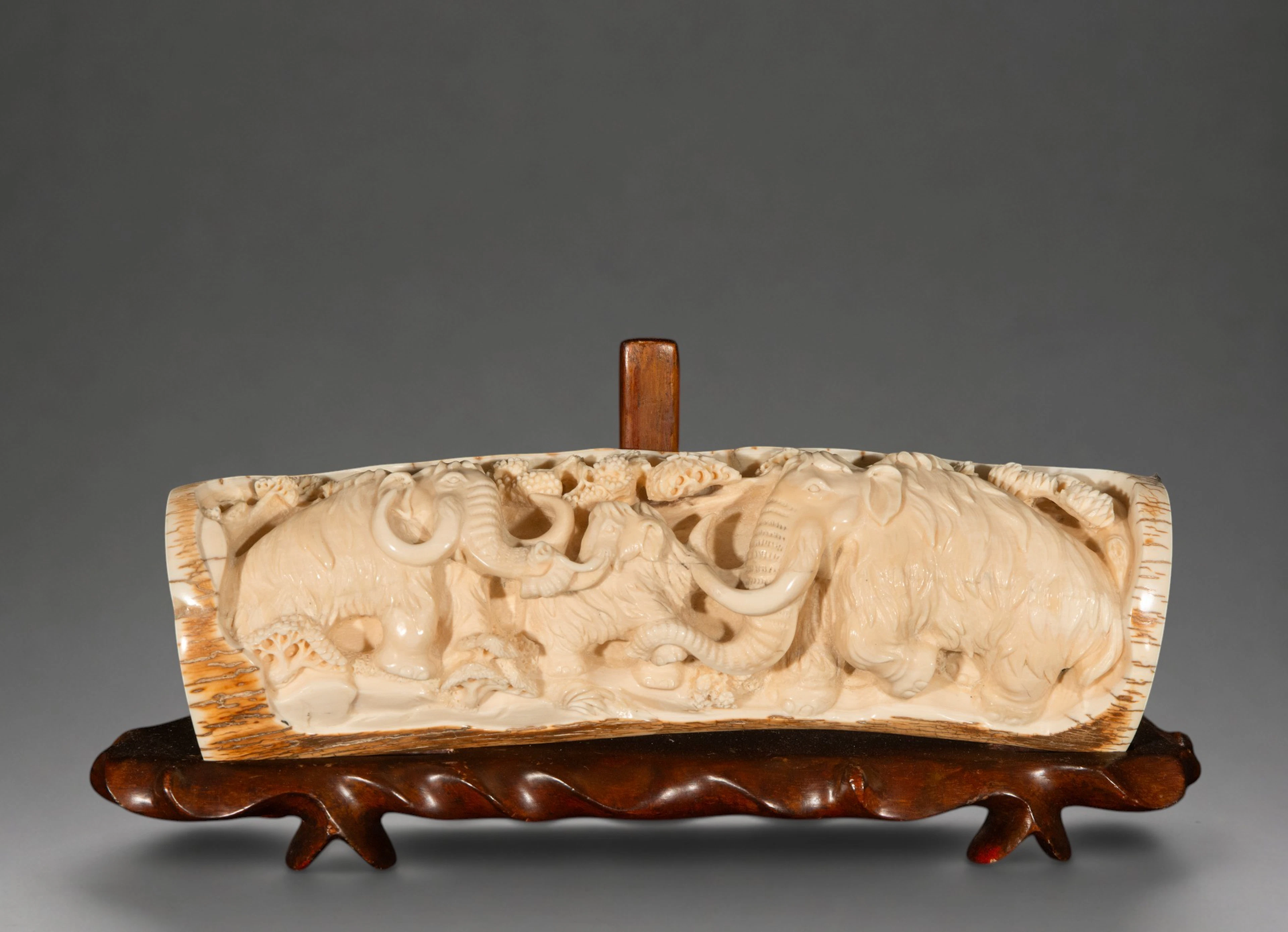 Mammoth tusk carved with elephants, signed – China – 20th century