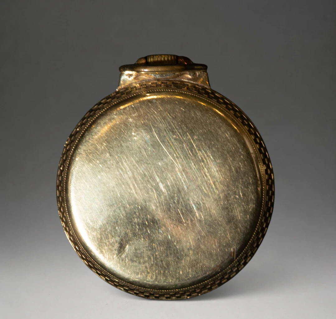 Pocket watch with decorated metal case